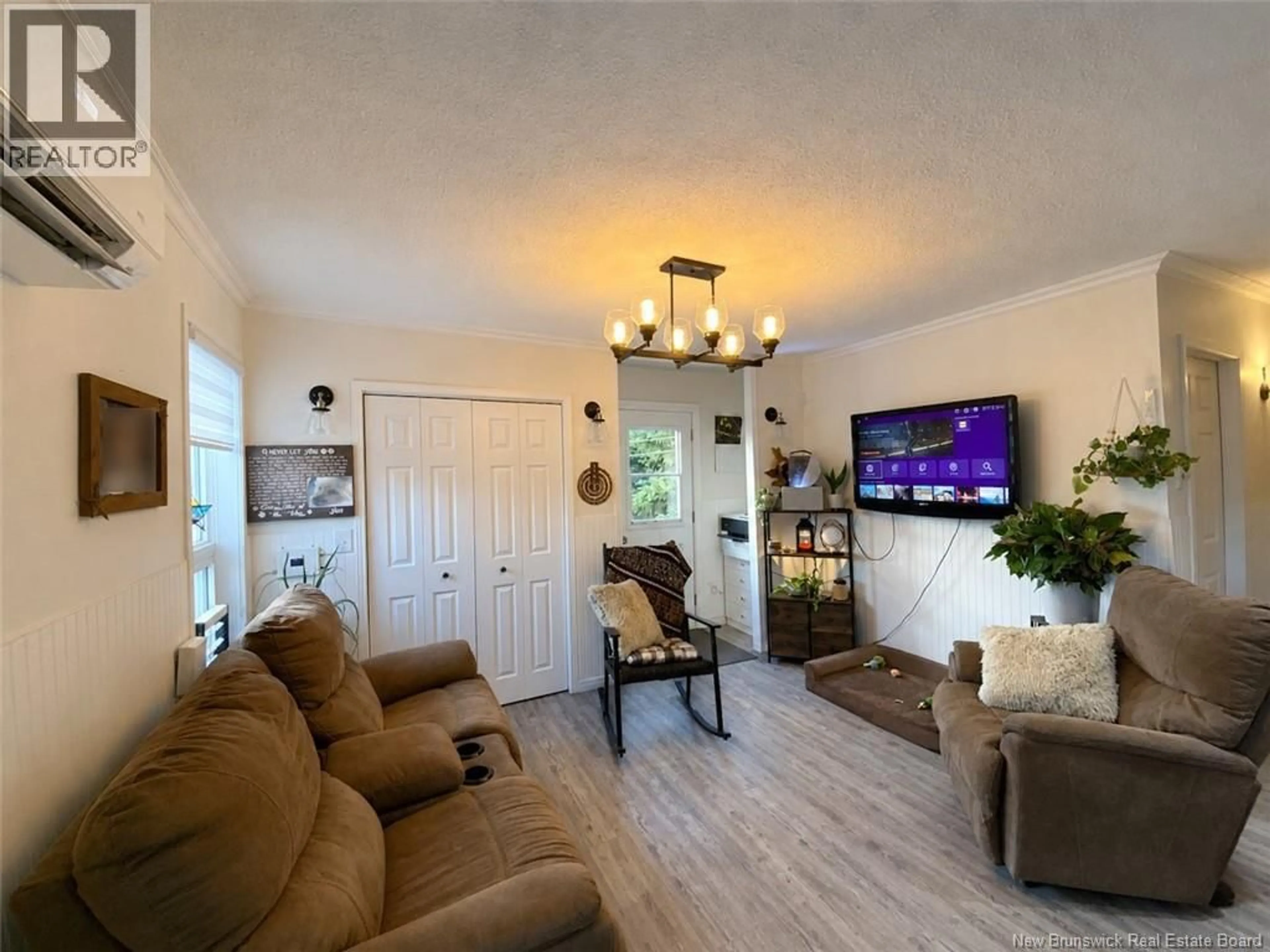 Living room with furniture, wood/laminate floor for 1792 MONTAGNE-DE-LA-CROIX ROAD, Sainte-Anne-De-Madawaska New Brunswick E7E1S1
