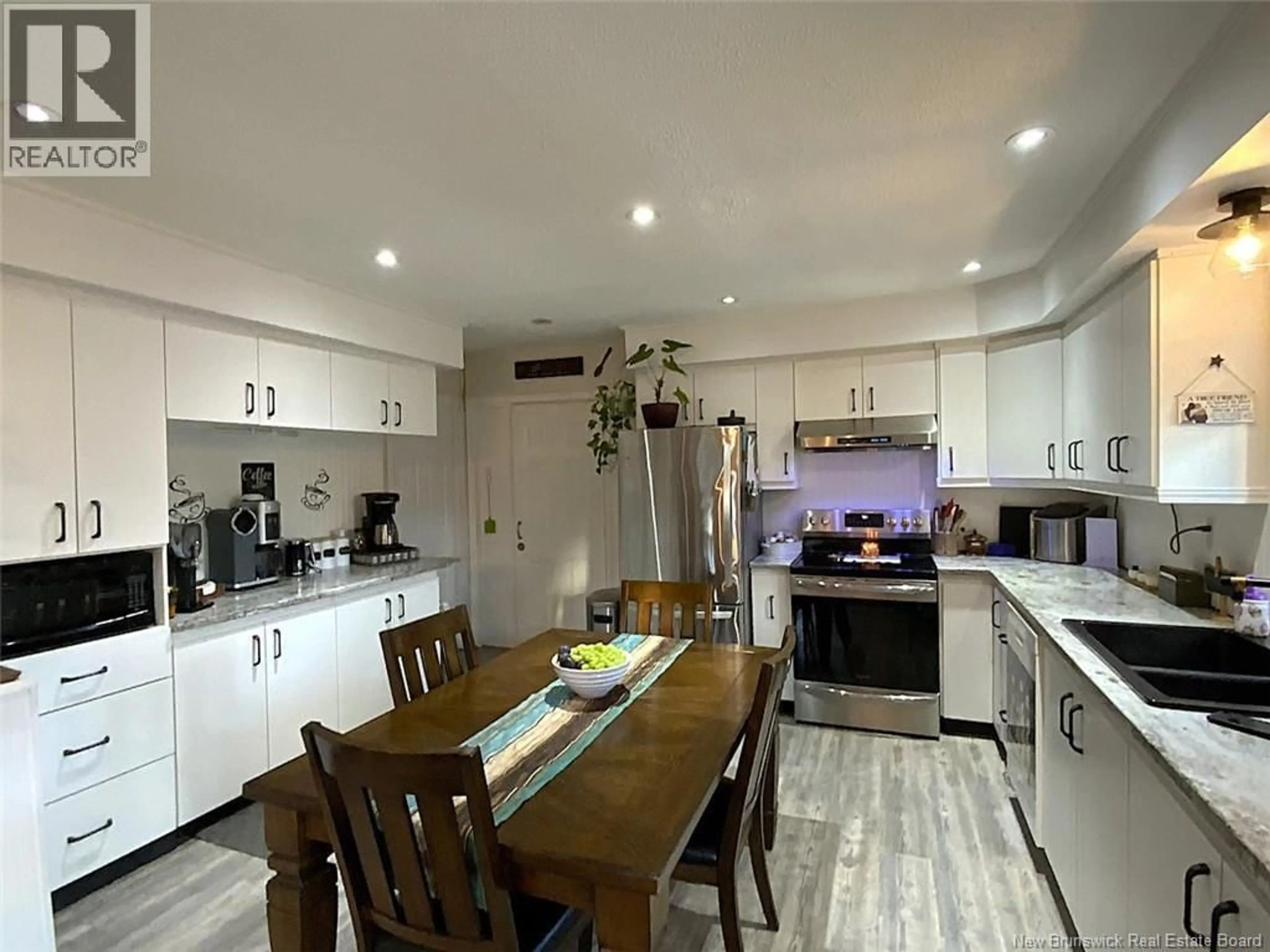 Open concept kitchen, wood/laminate floor for 1792 MONTAGNE-DE-LA-CROIX ROAD, Sainte-Anne-De-Madawaska New Brunswick E7E1S1