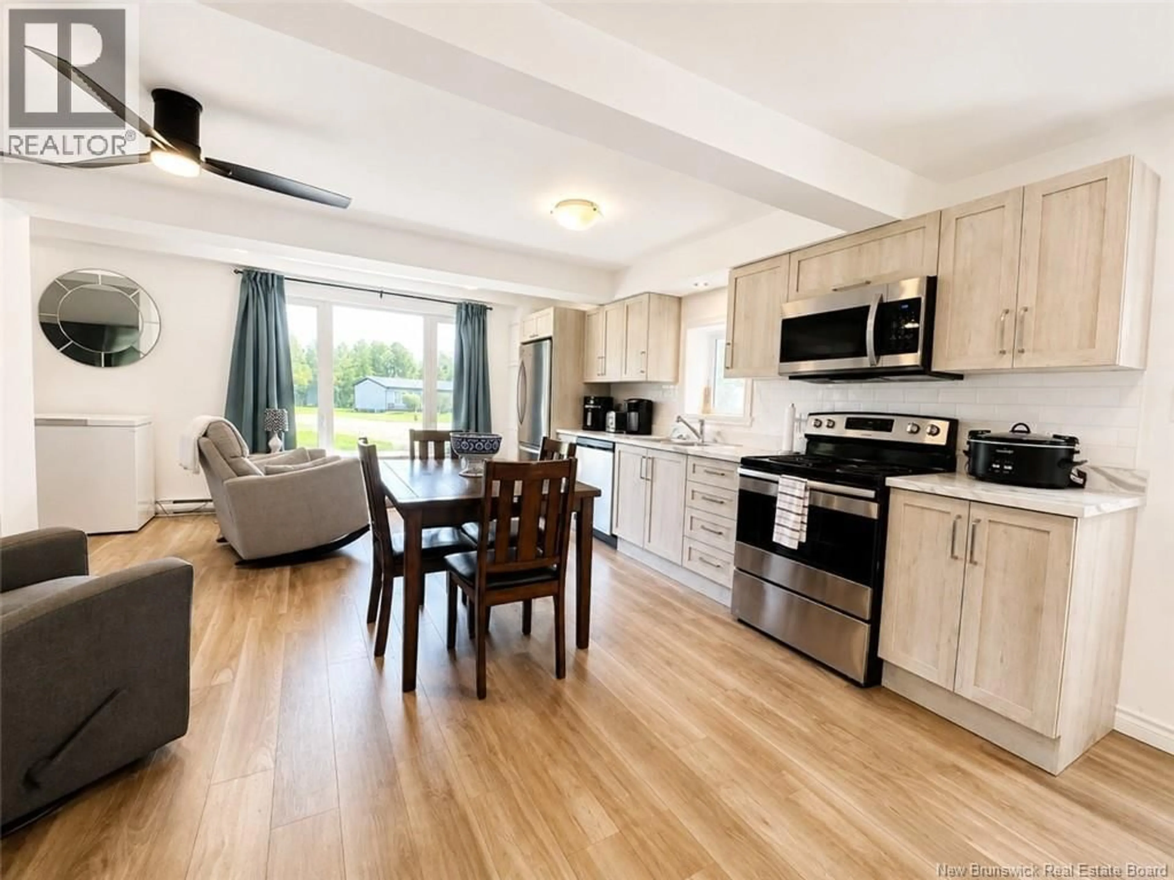 Open concept kitchen, wood/laminate floor for 94 PRINCIPALE STREET, Eel River Crossing New Brunswick E8E1T1