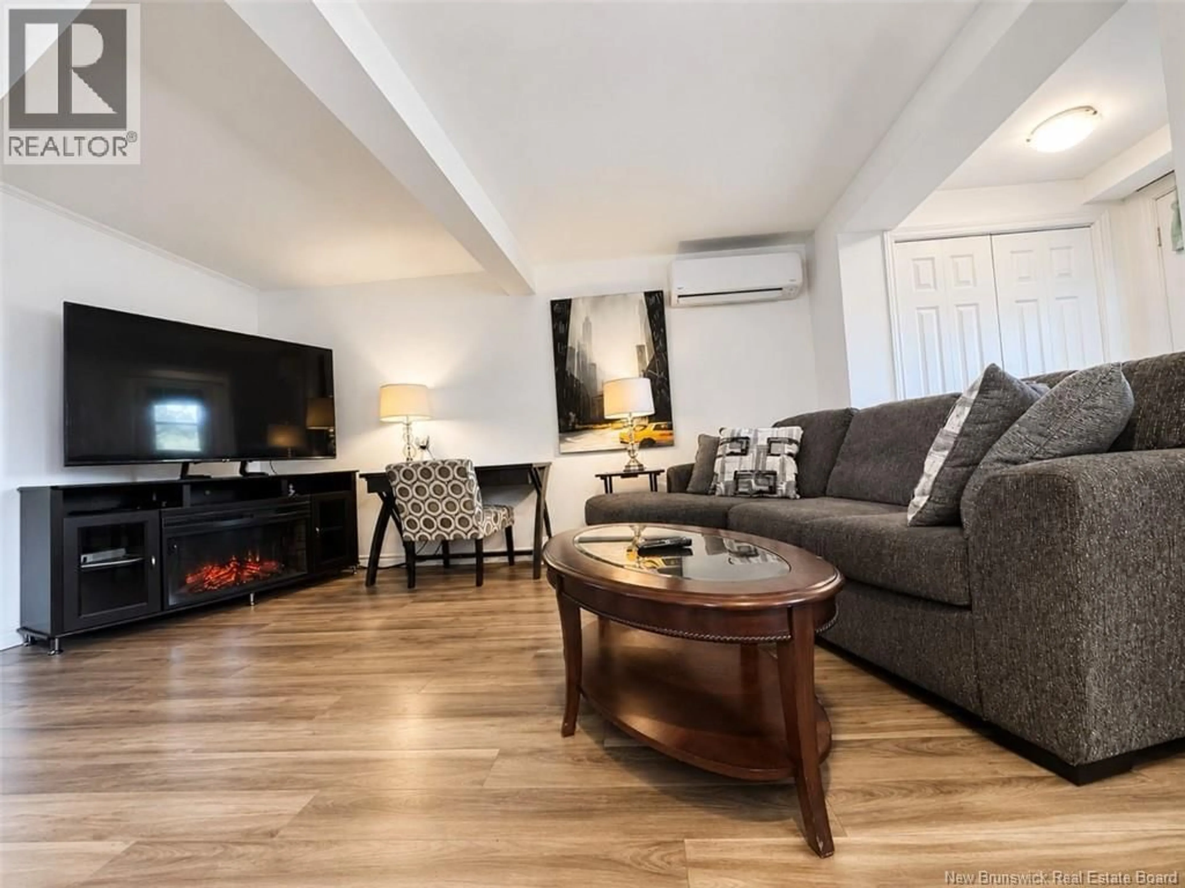 Living room with furniture, wood/laminate floor for 94 PRINCIPALE STREET, Eel River Crossing New Brunswick E8E1T1