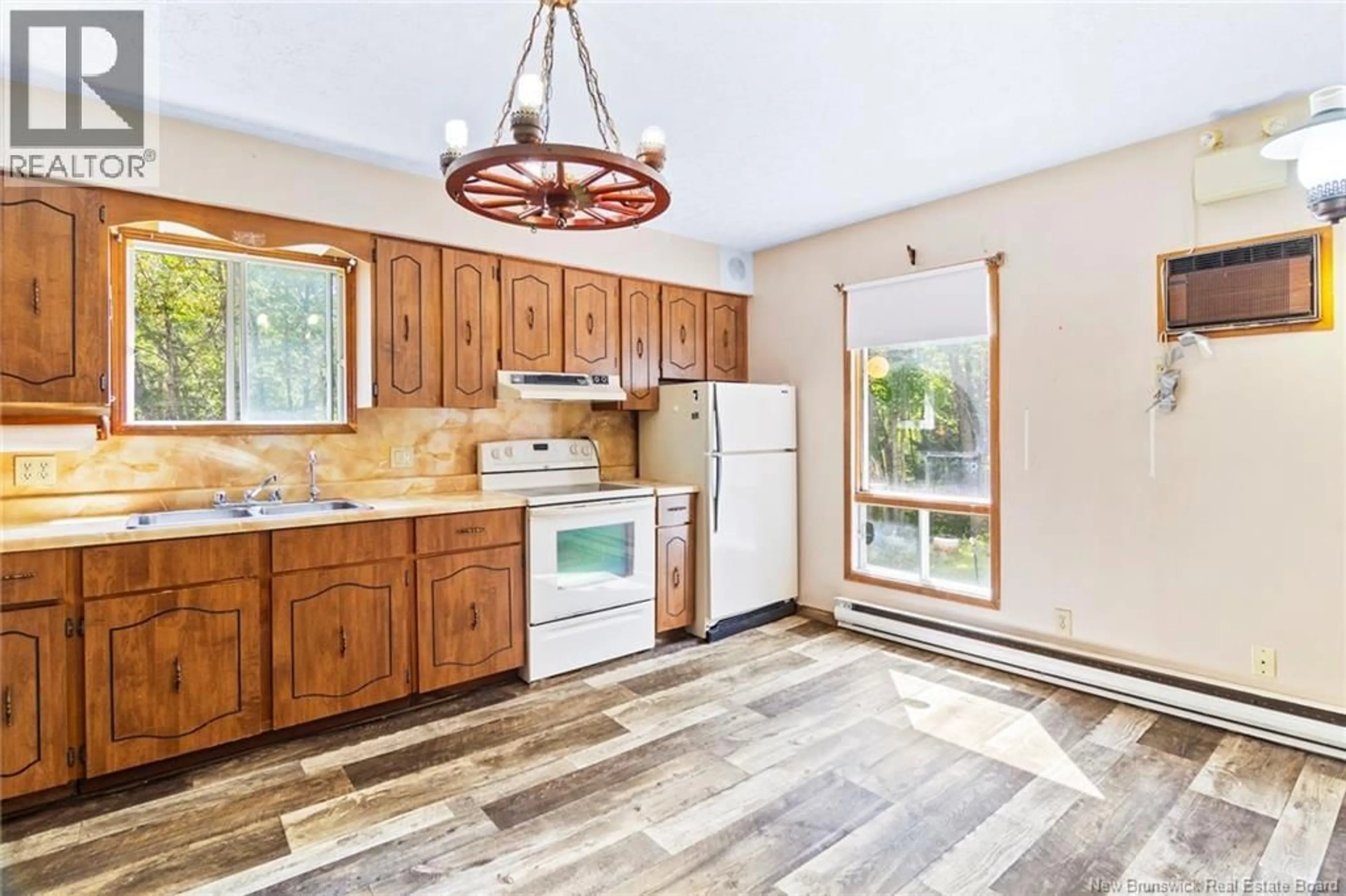 Open concept kitchen, ceramic/tile floor for 82 CHESTNUT DRIVE, Minto New Brunswick E4B3L5