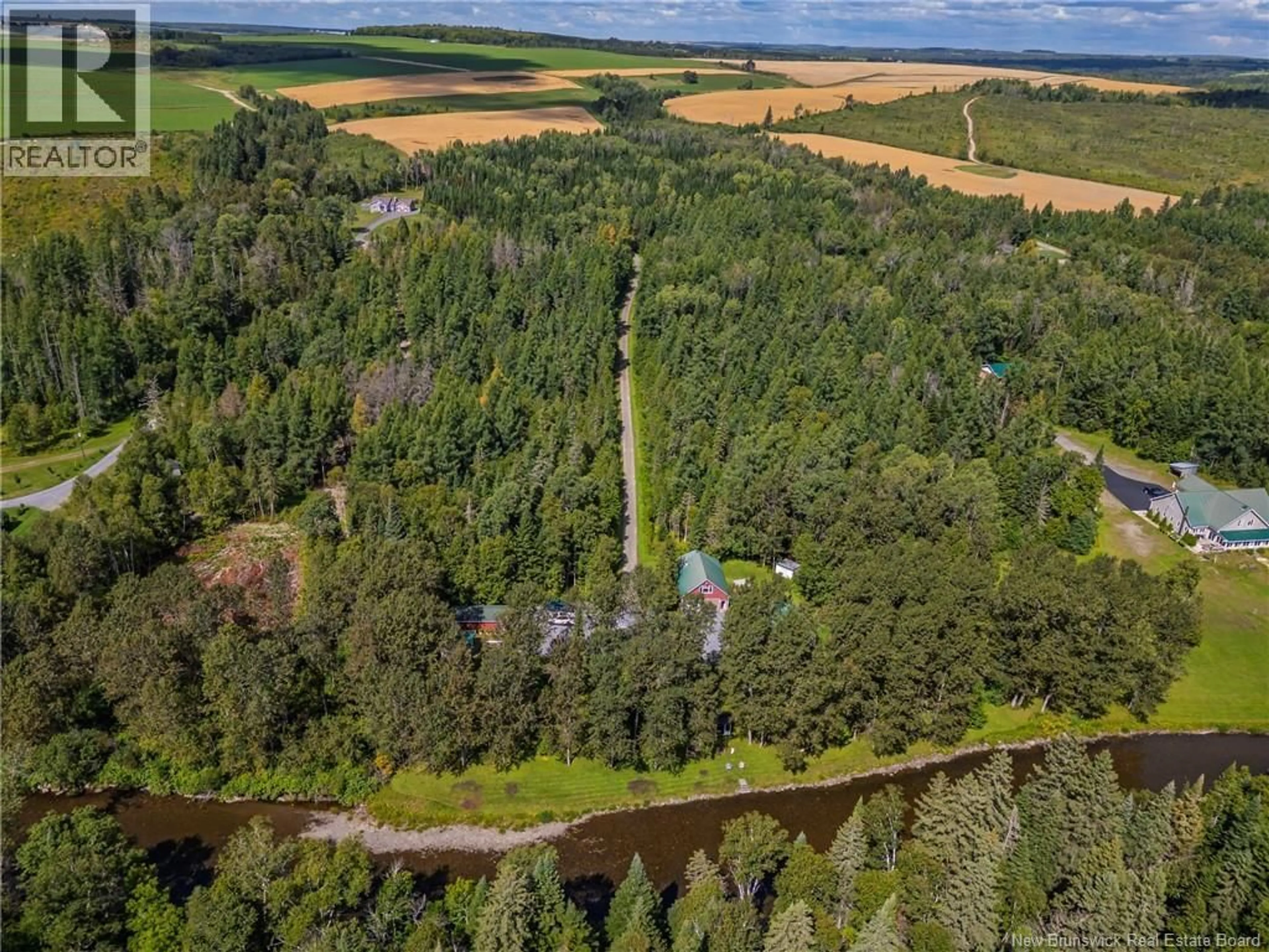 A pic from outside/outdoor area/front of a property/back of a property/a pic from drone, forest/trees view for 38 CH CAMP, DSL de Drummond/DSL of Drummond New Brunswick E3Y3X9