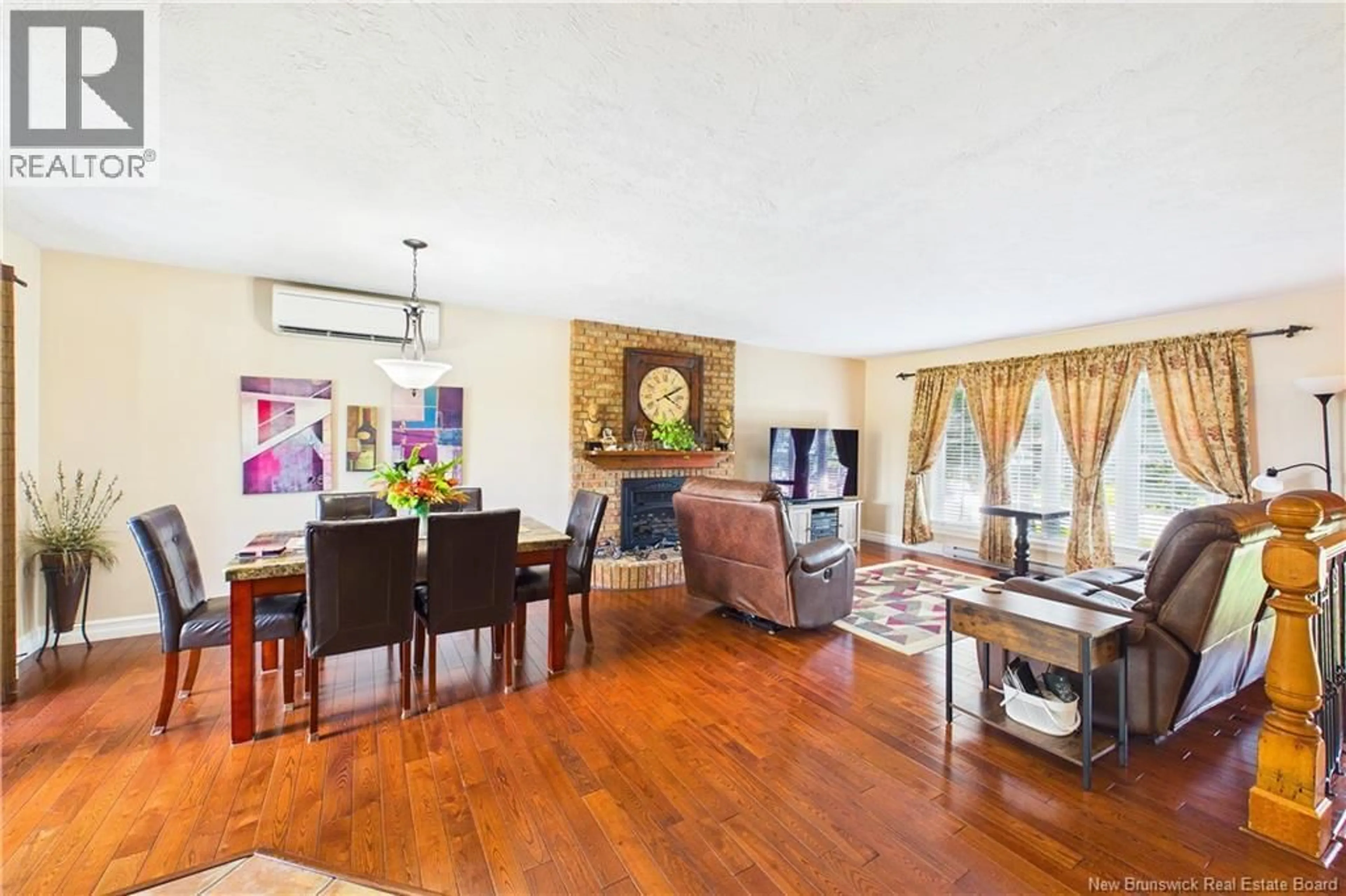 Living room with furniture, wood/laminate floor for 23 POINTE AUX RENARDS, Dieppe New Brunswick E1A7W7