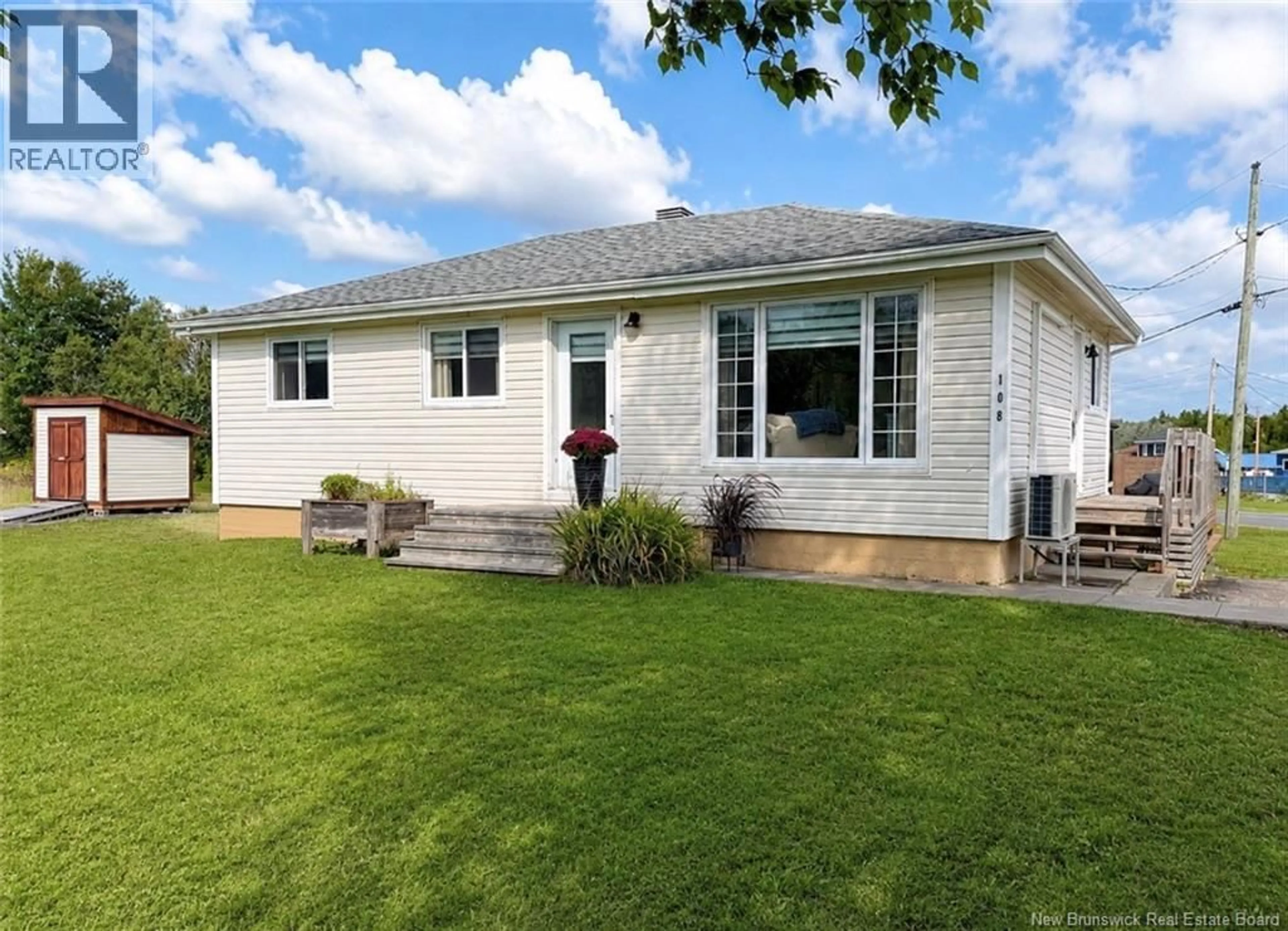 Home with vinyl exterior material, street for 108 KENT LODGE, Beresford New Brunswick E8K1B6