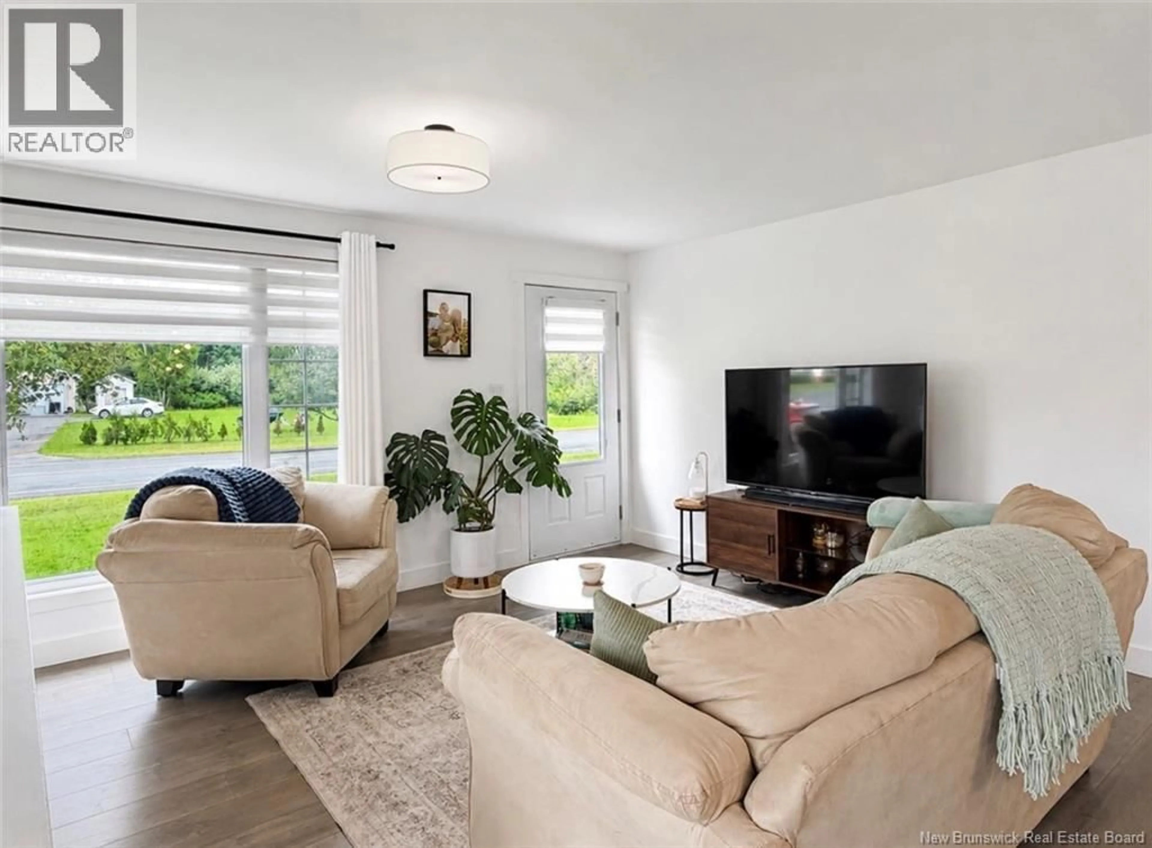 Living room with furniture, unknown for 108 KENT LODGE, Beresford New Brunswick E8K1B6