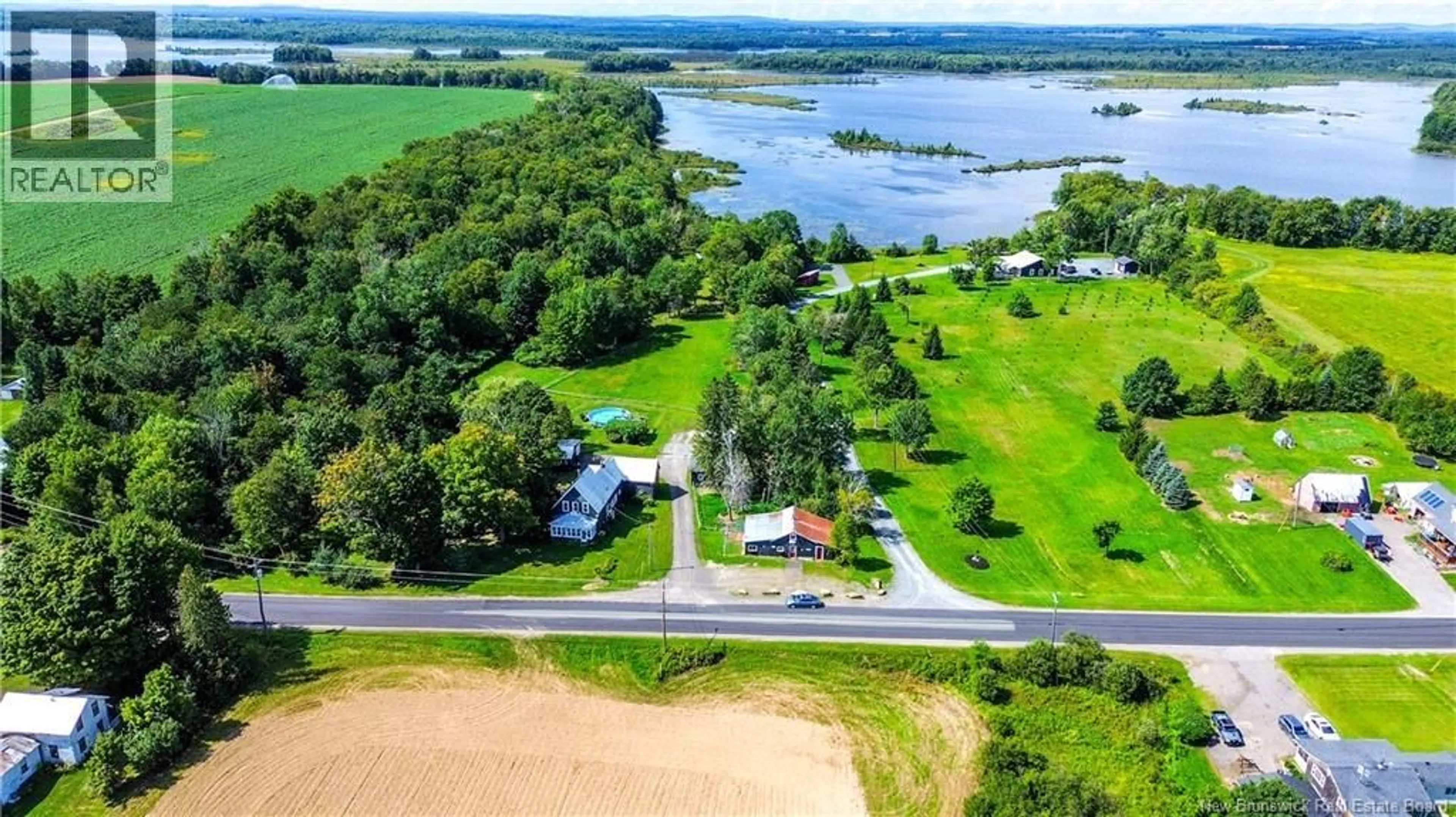 A pic from outside/outdoor area/front of a property/back of a property/a pic from drone, water/lake/river/ocean view for 2095 ROUTE 560, Lakeville New Brunswick E7K1T7