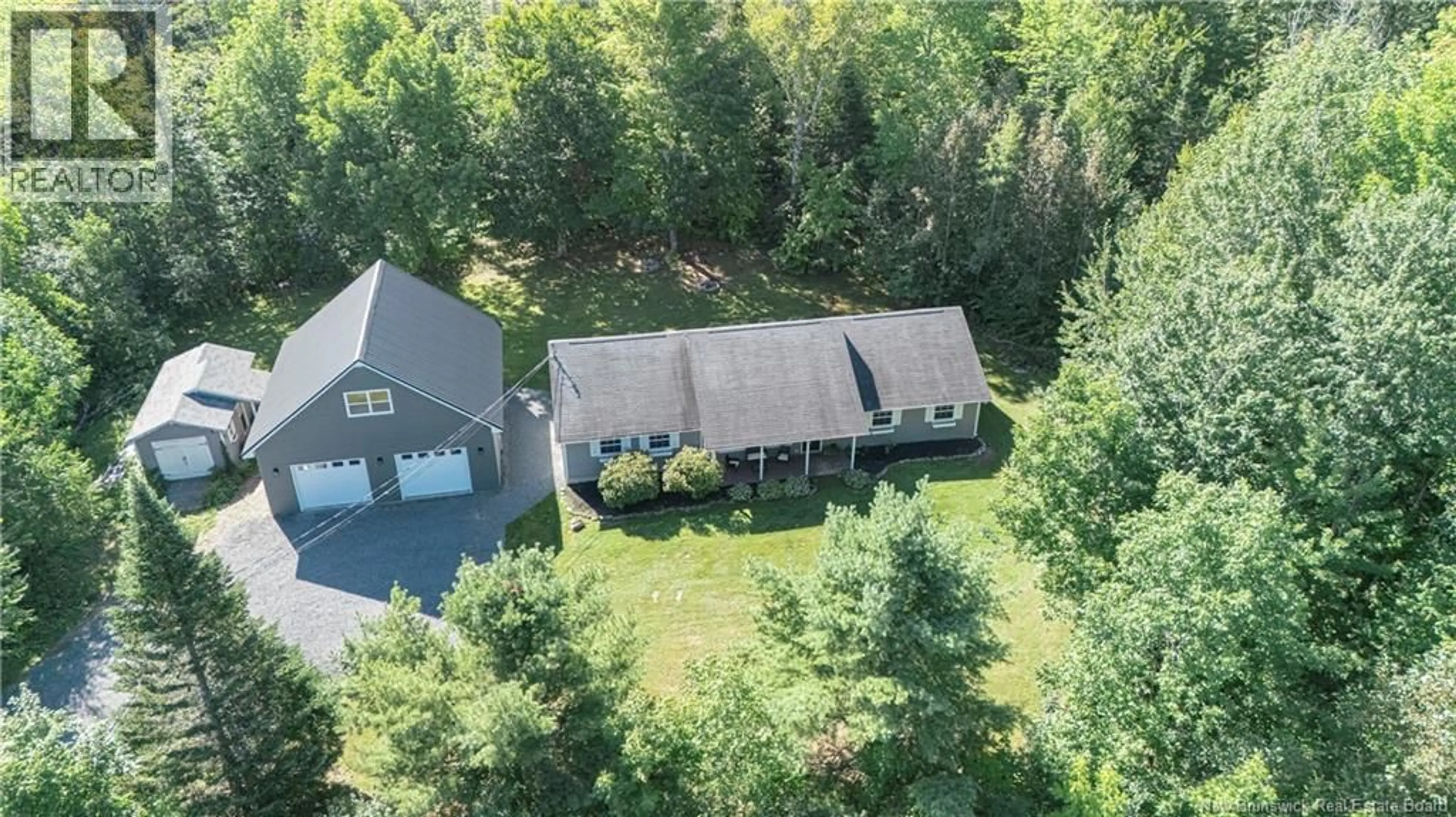 A pic from outside/outdoor area/front of a property/back of a property/a pic from drone, forest/trees view for 122 FAWN CRESCENT, Hanwell New Brunswick E3E1B5