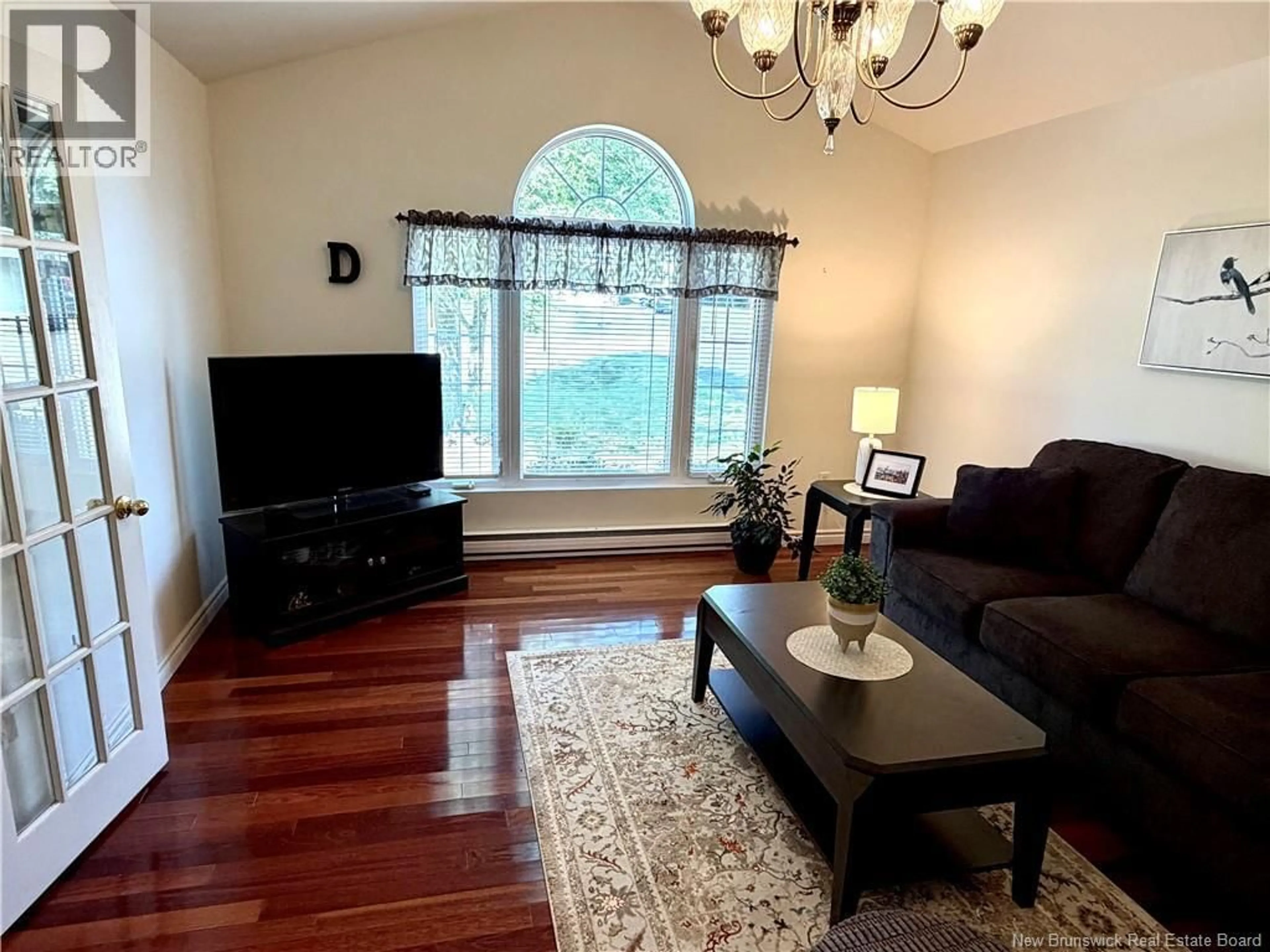 Living room with furniture, wood/laminate floor for 28 CHATWIN STREET, Rothesay New Brunswick E2S1A3