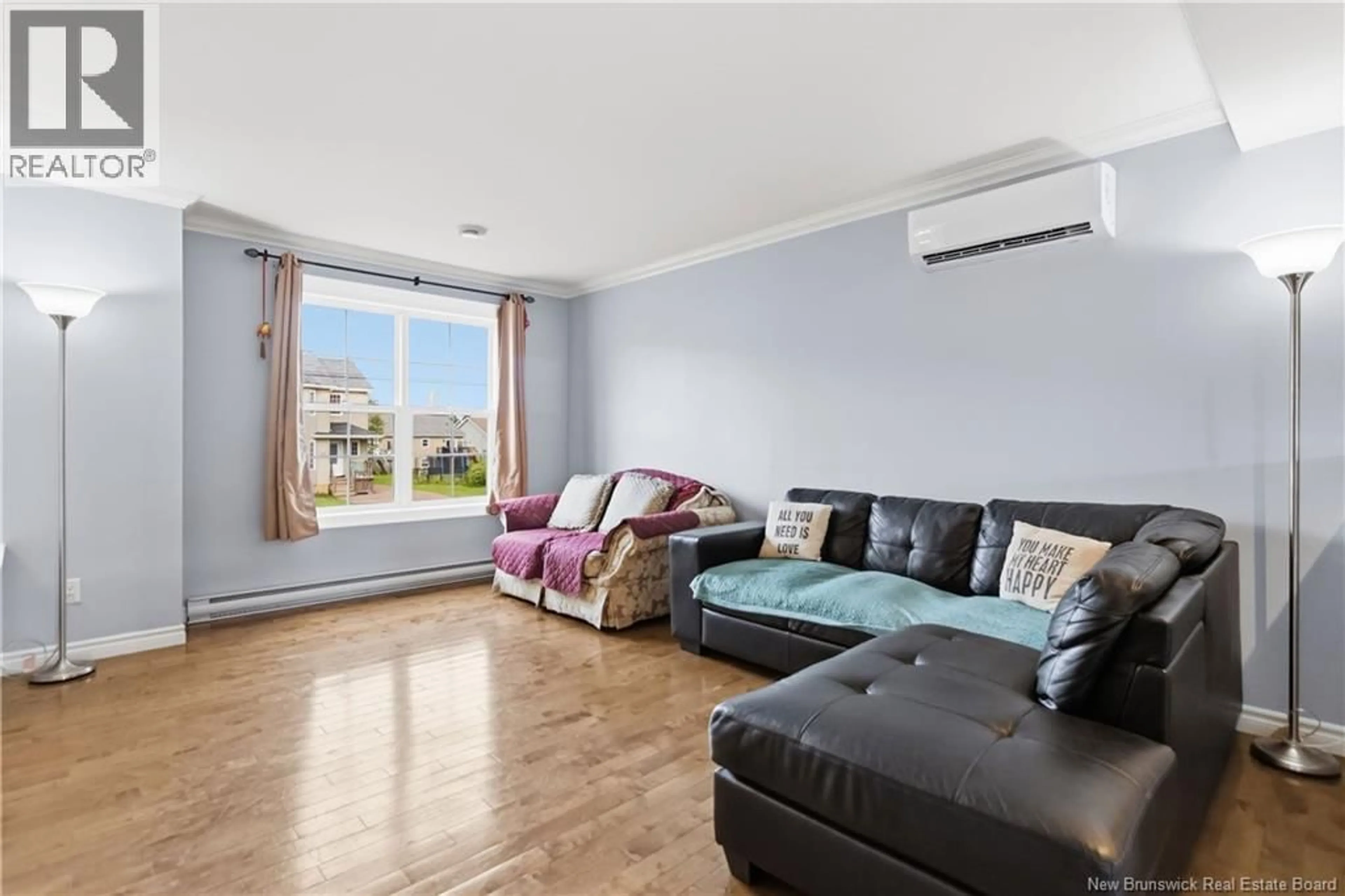 Living room with furniture, wood/laminate floor for 118 CORIANDER STREET, Moncton New Brunswick E1G0R8