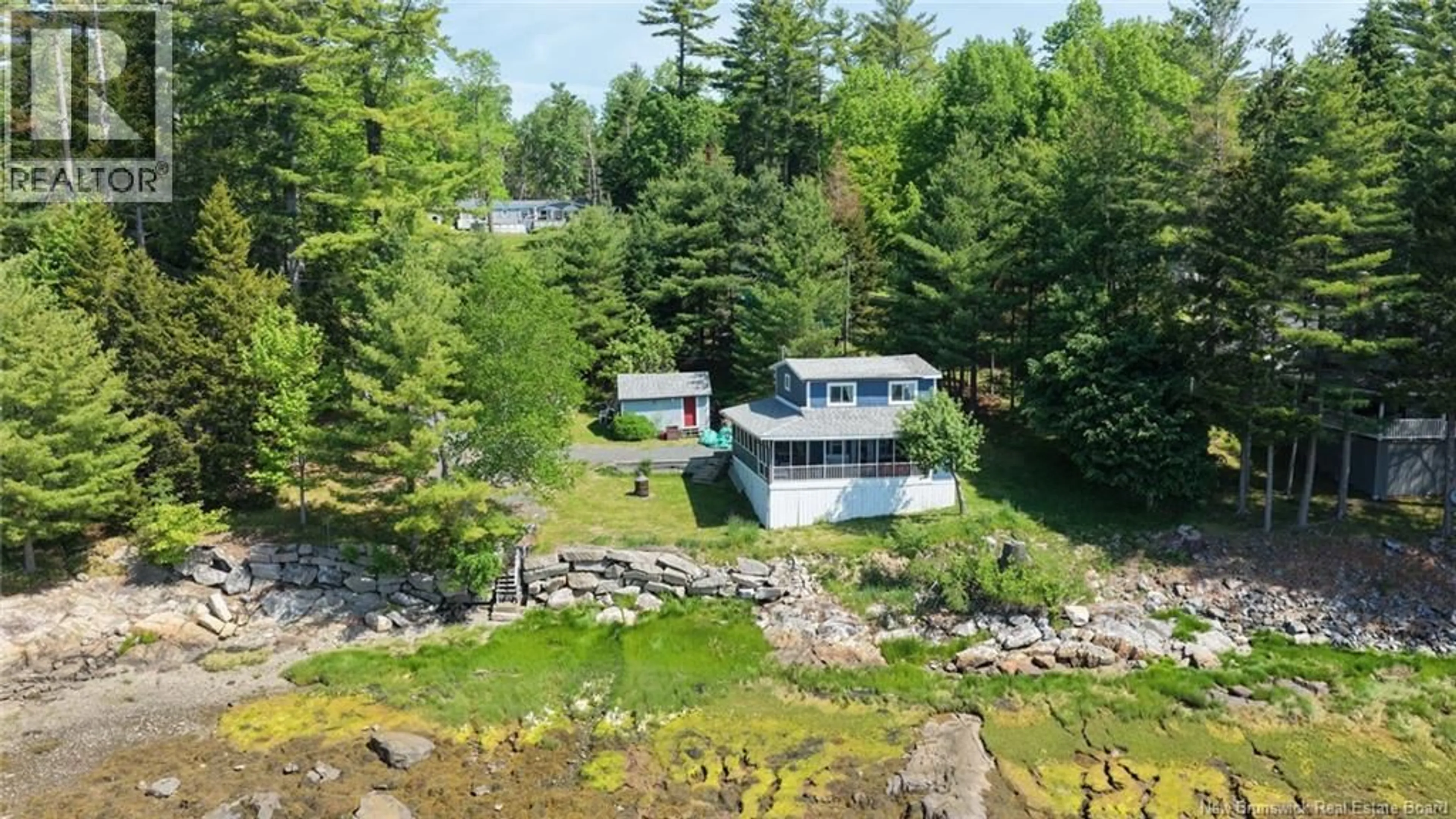 A pic from outside/outdoor area/front of a property/back of a property/a pic from drone, water/lake/river/ocean view for 12 BAYVIEW DRIVE, Dufferin New Brunswick E3L3R9