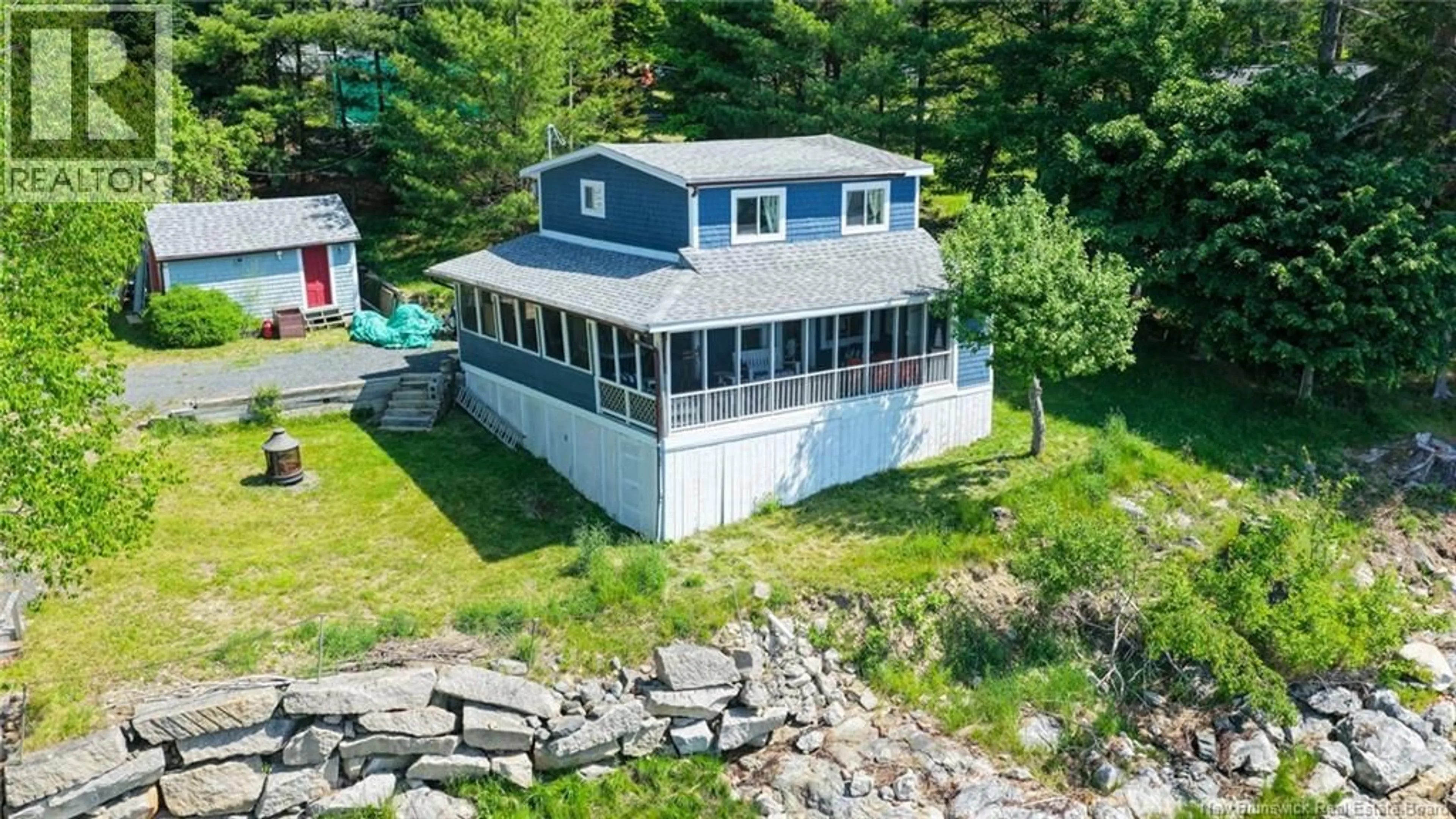 A pic from outside/outdoor area/front of a property/back of a property/a pic from drone, water/lake/river/ocean view for 12 BAYVIEW DRIVE, Dufferin New Brunswick E3L3R9