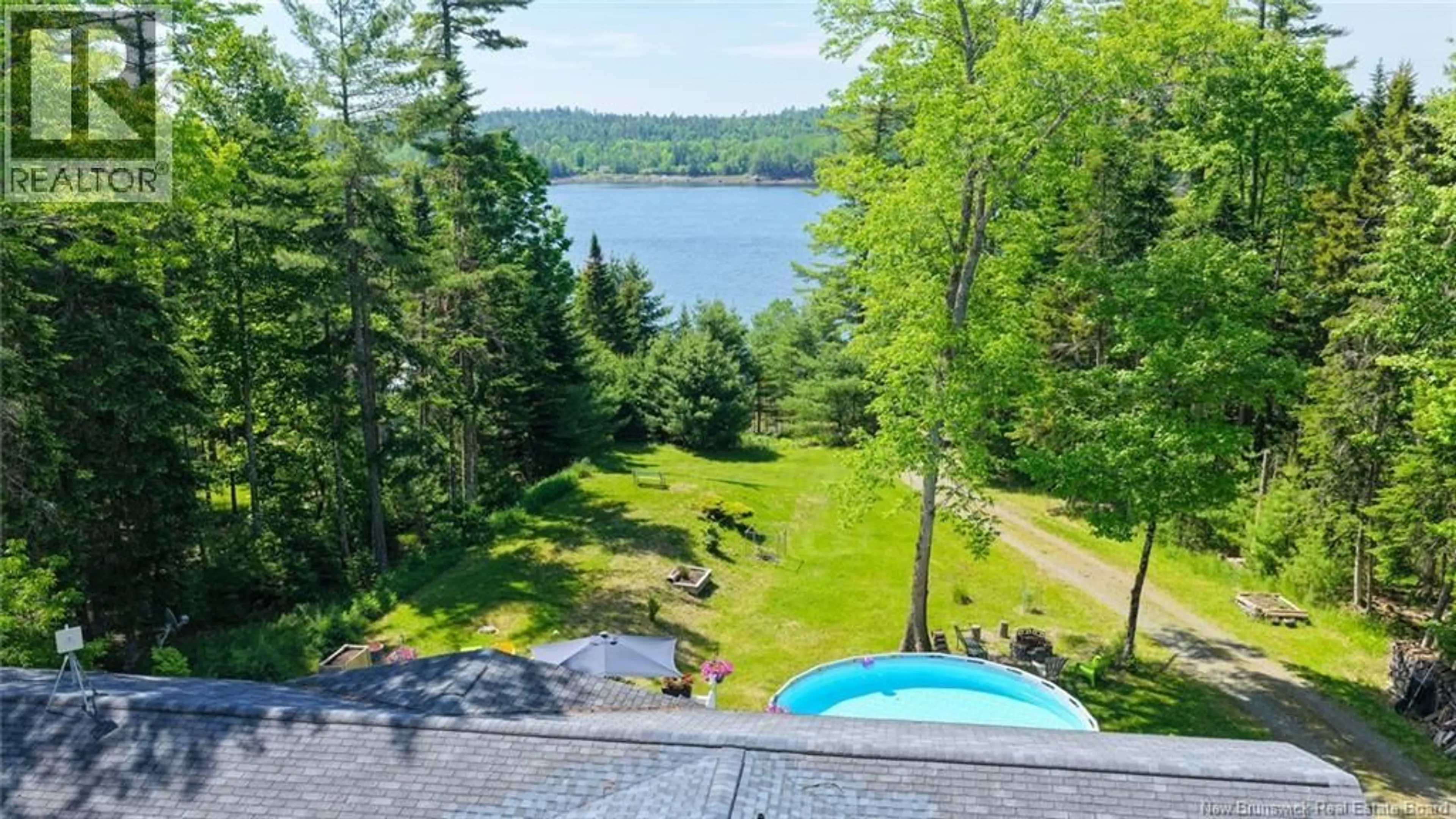 A pic from outside/outdoor area/front of a property/back of a property/a pic from drone, water/lake/river/ocean view for 12 BAYVIEW DRIVE, Dufferin New Brunswick E3L3R9