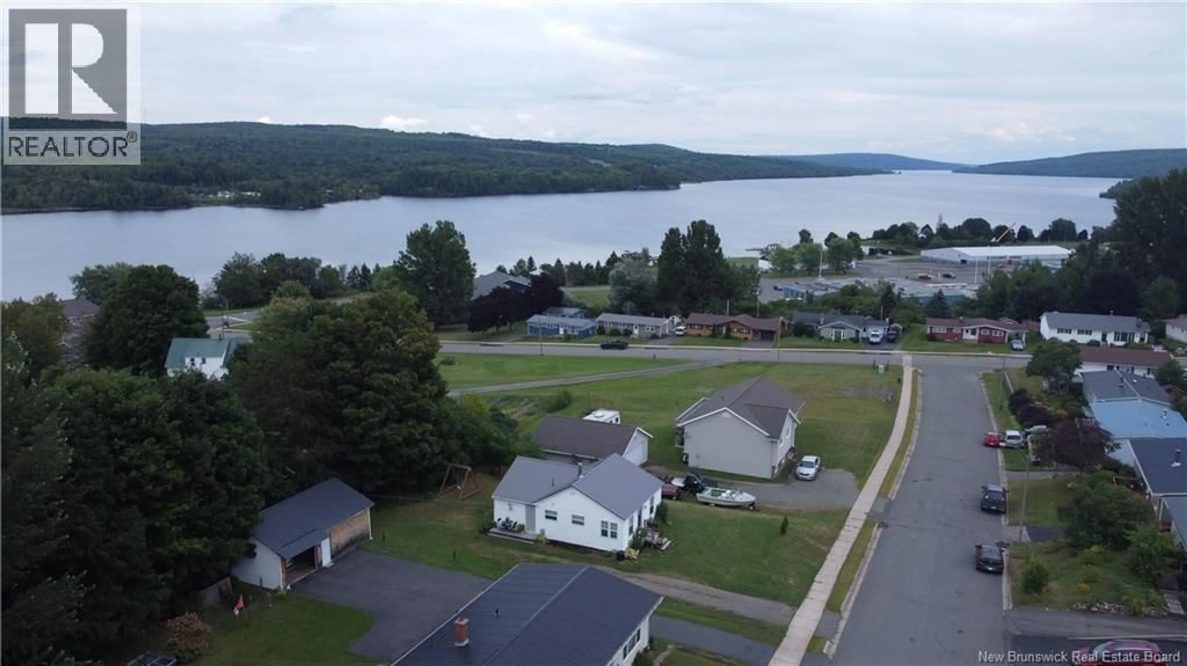 A pic from outside/outdoor area/front of a property/back of a property/a pic from drone, water/lake/river/ocean view for 22 TODD ST, Nackawic New Brunswick E6G1B8