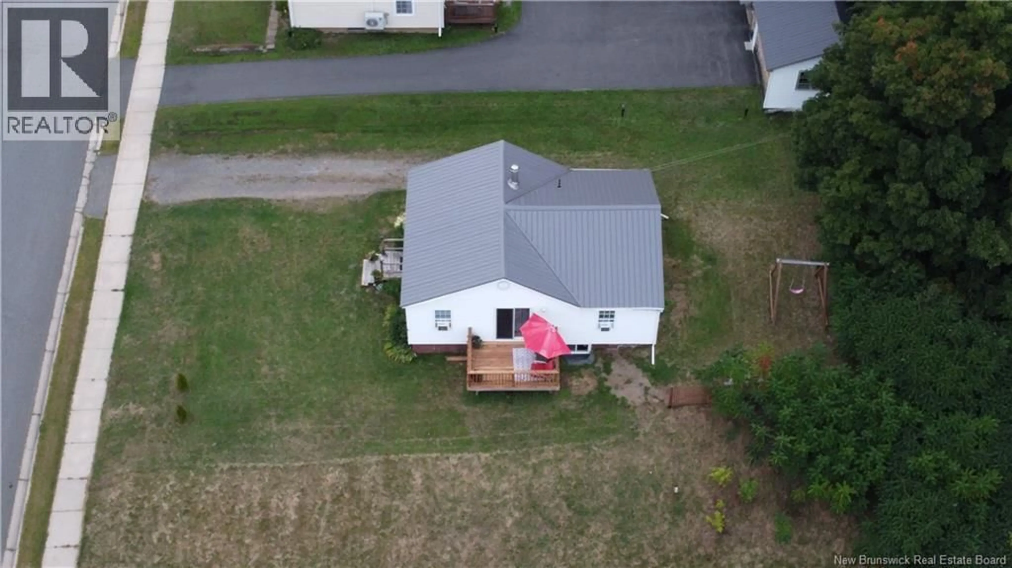 A pic from outside/outdoor area/front of a property/back of a property/a pic from drone, street for 22 TODD ST, Nackawic New Brunswick E6G1B8