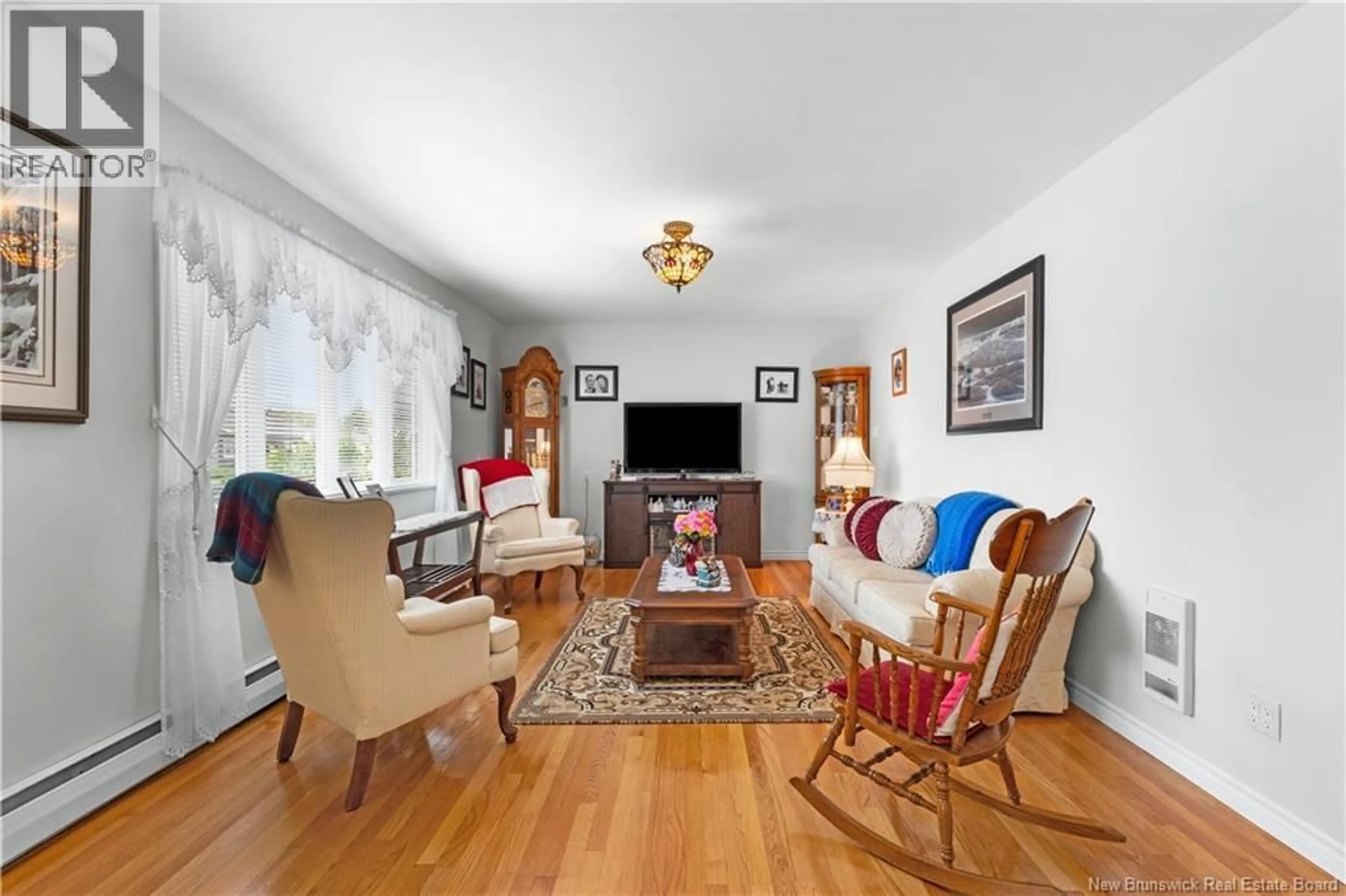 Living room with furniture, wood/laminate floor for 79 POIRIER DRIVE, Moncton New Brunswick E1C7R9