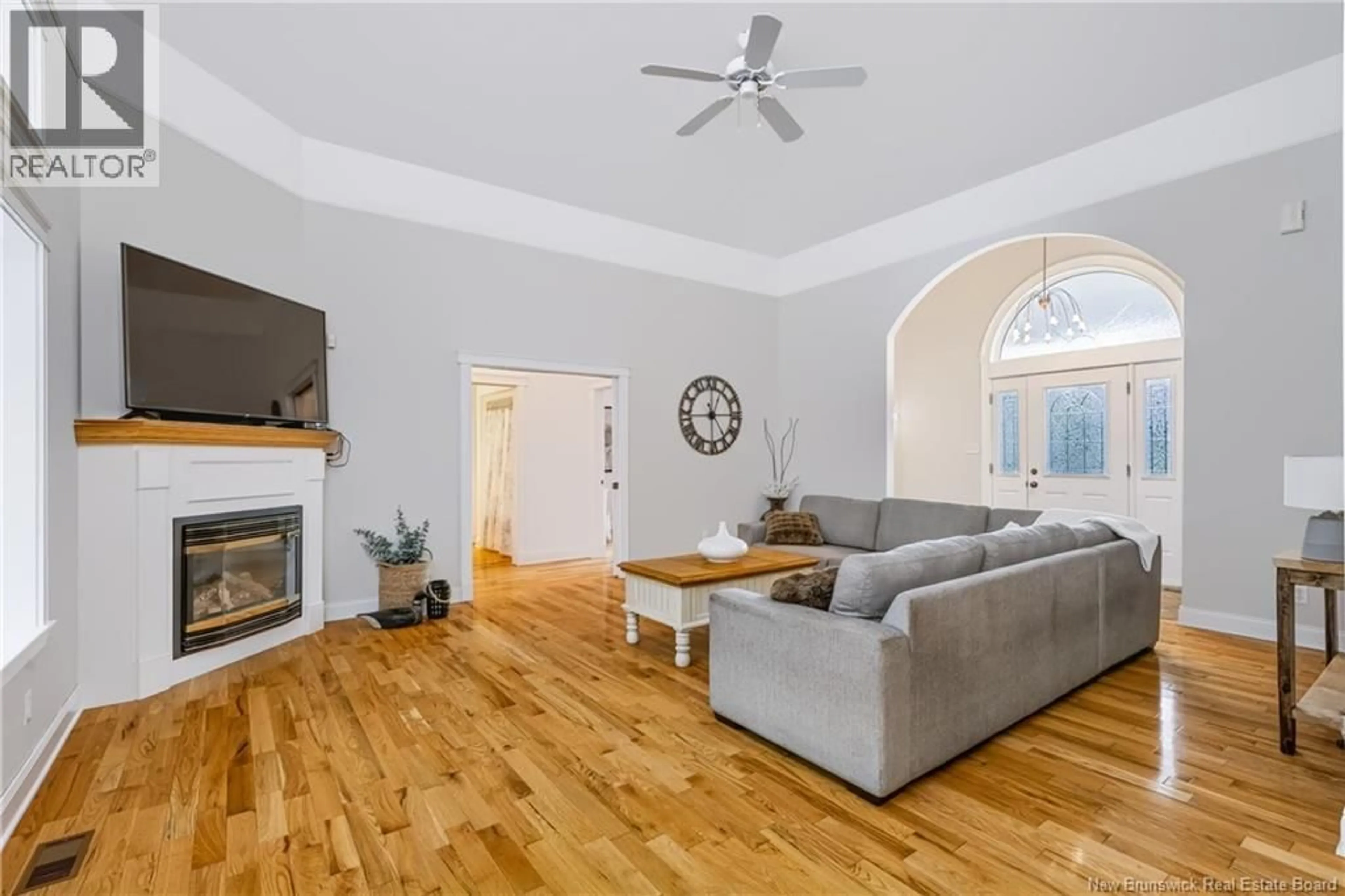 Living room with furniture, wood/laminate floor for 14 CARLISLE ROAD, Douglas New Brunswick E3G7N2