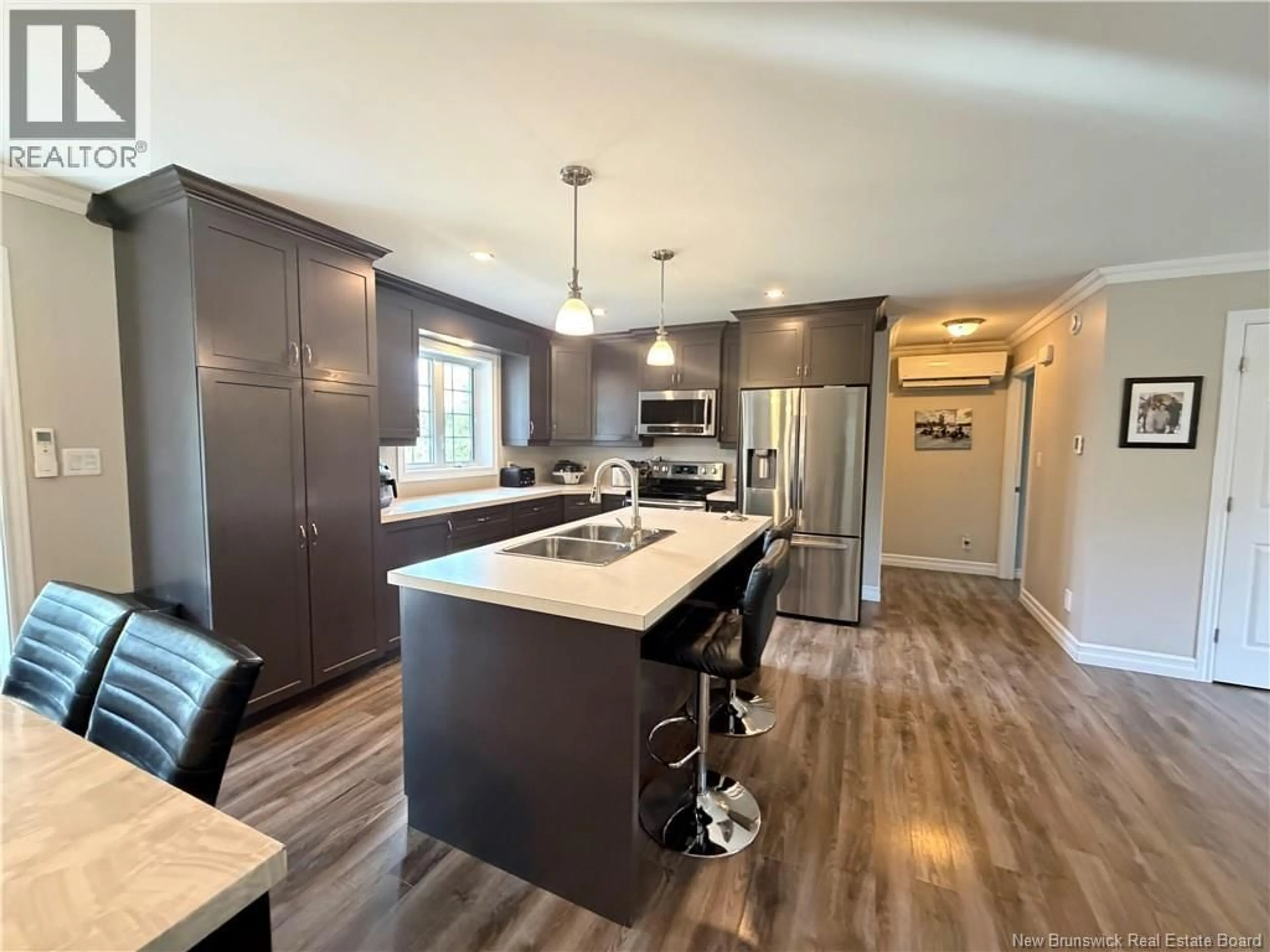Open concept kitchen, wood/laminate floor for 5712 ROUTE 17, Saint-Quentin New Brunswick E8A2J1
