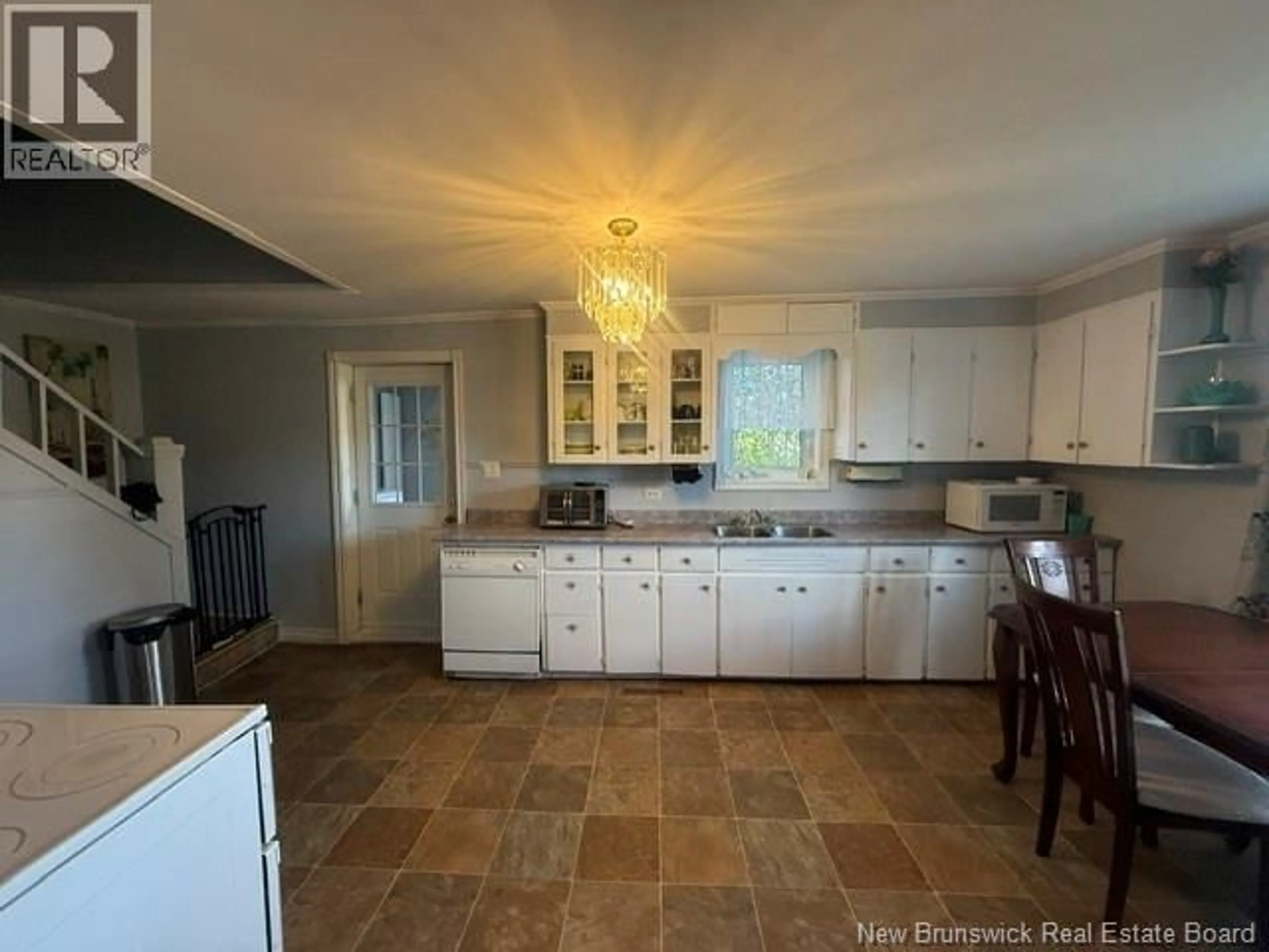Open concept kitchen, ceramic/tile floor for 18 SAVOIE STREET, Eel River Crossing New Brunswick E8E1T8