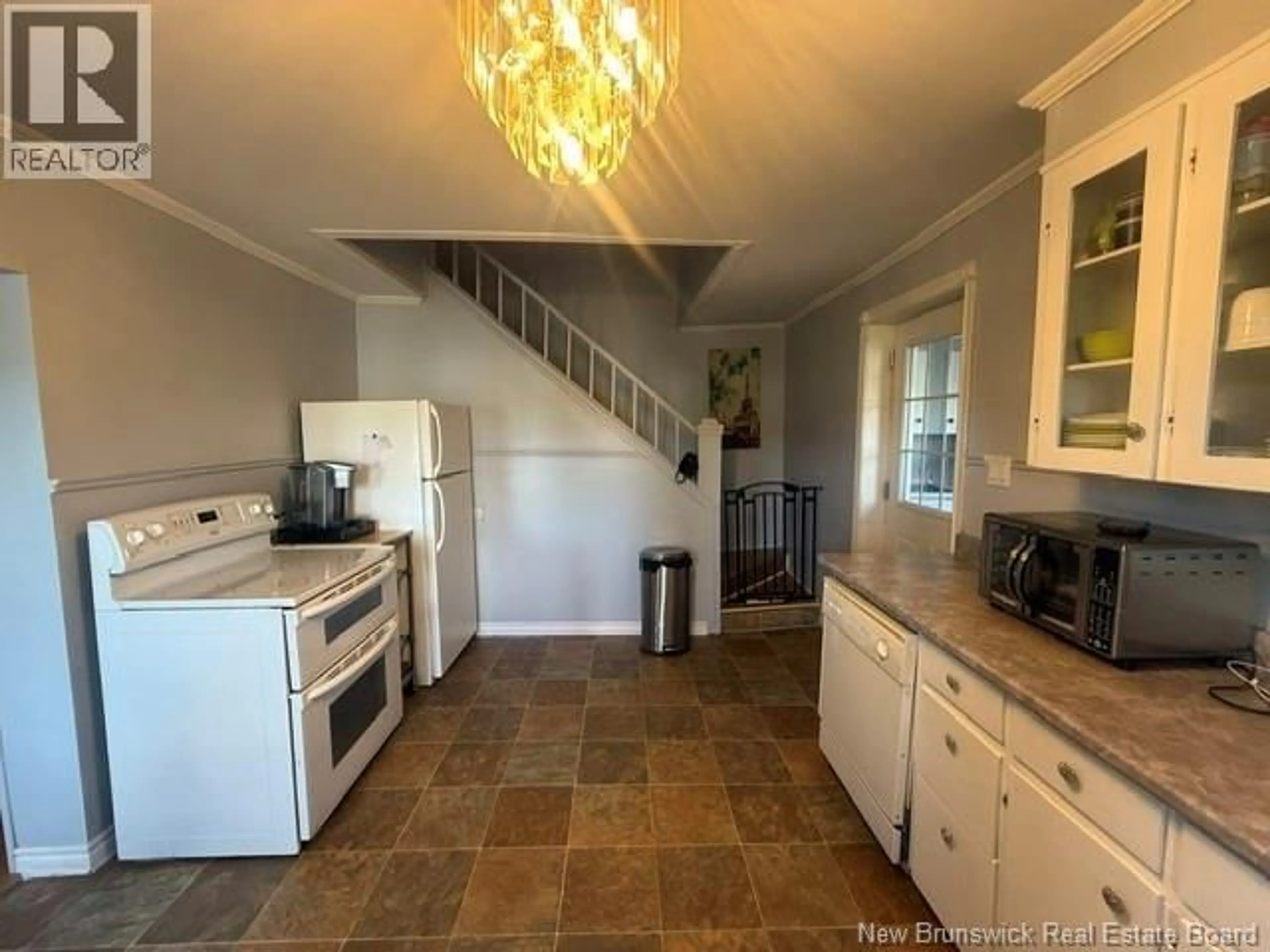 Open concept kitchen, ceramic/tile floor for 18 SAVOIE STREET, Eel River Crossing New Brunswick E8E1T8