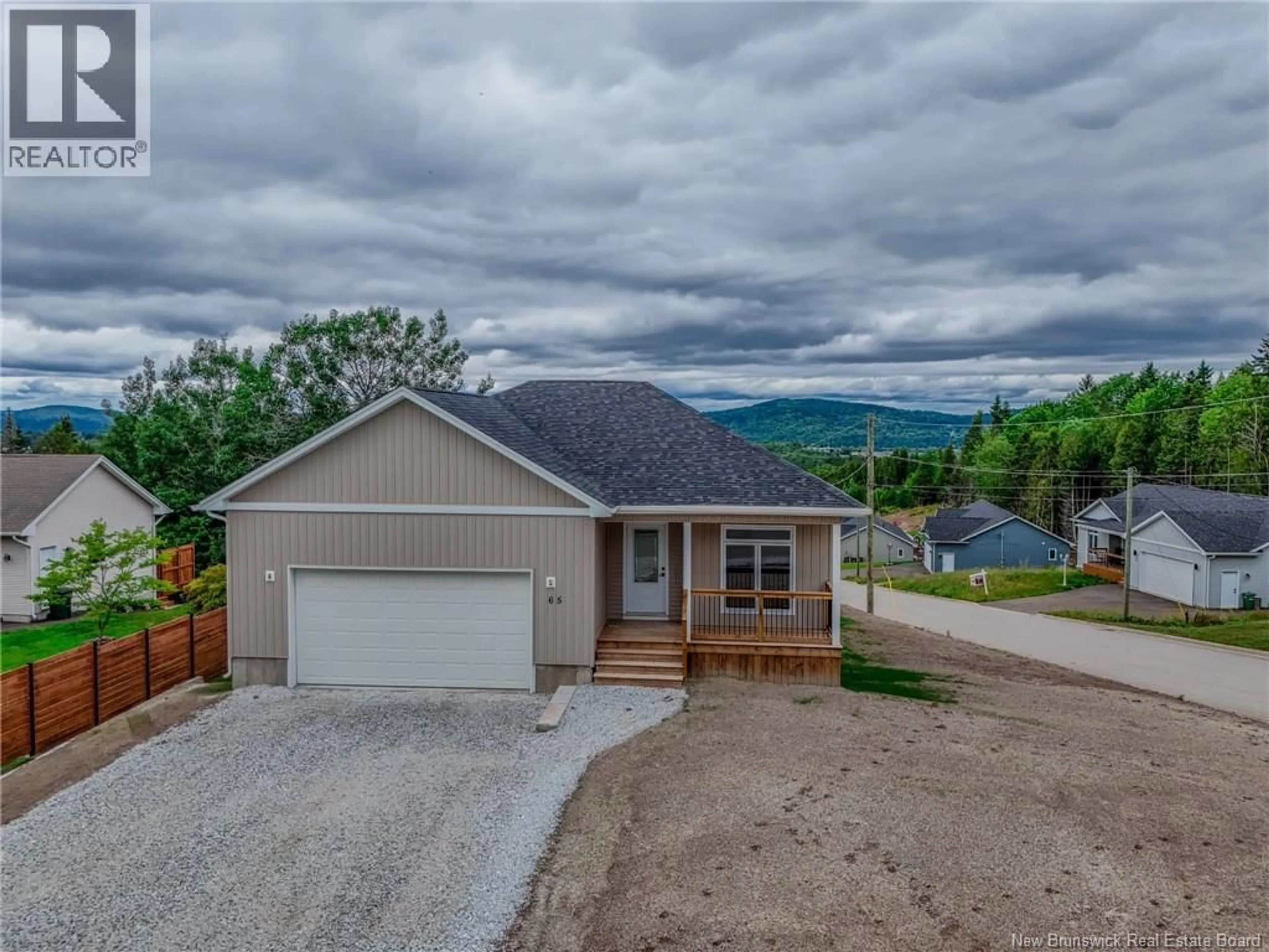 A pic from outside/outdoor area/front of a property/back of a property/a pic from drone, water/lake/river/ocean view for 65 SQUIRE DRIVE, Quispamsis New Brunswick E2G1C1