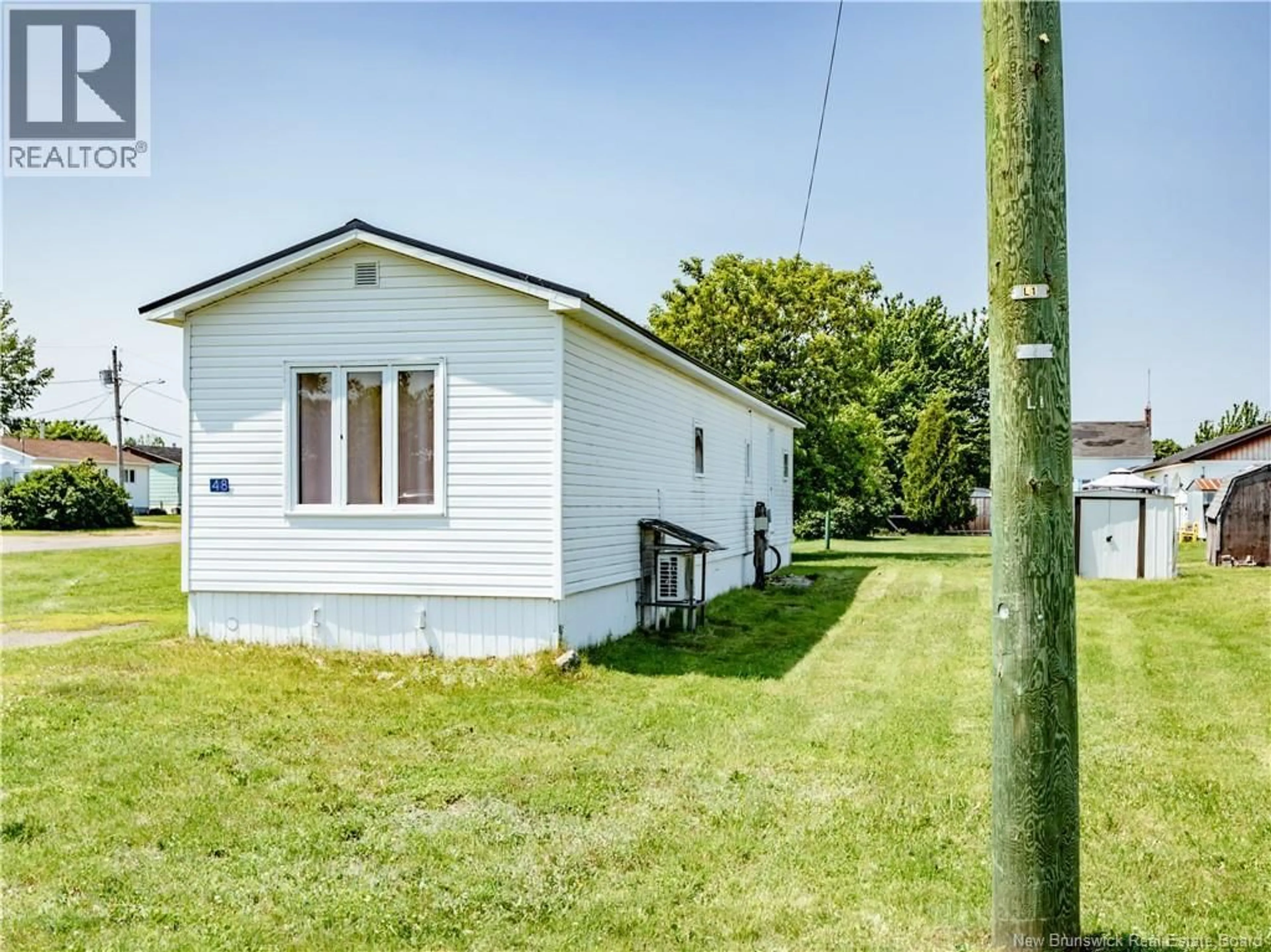 A pic from outside/outdoor area/front of a property/back of a property/a pic from drone, street for 48 RUE DES COPAINS, Richibucto New Brunswick E4W3X7