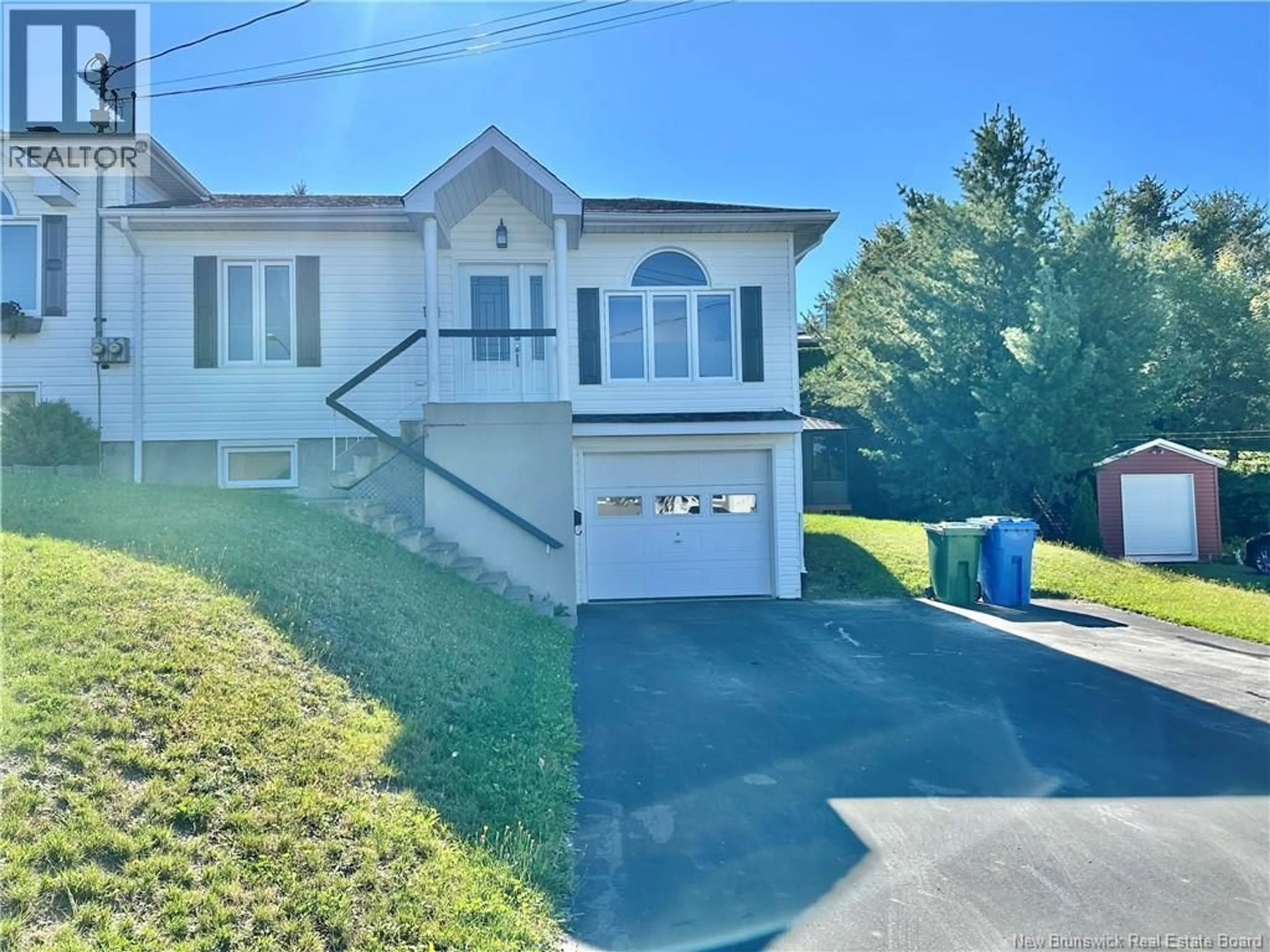 A pic from outside/outdoor area/front of a property/back of a property/a pic from drone, street for 121 BELISLE AVENUE, Edmundston New Brunswick E3V4C7