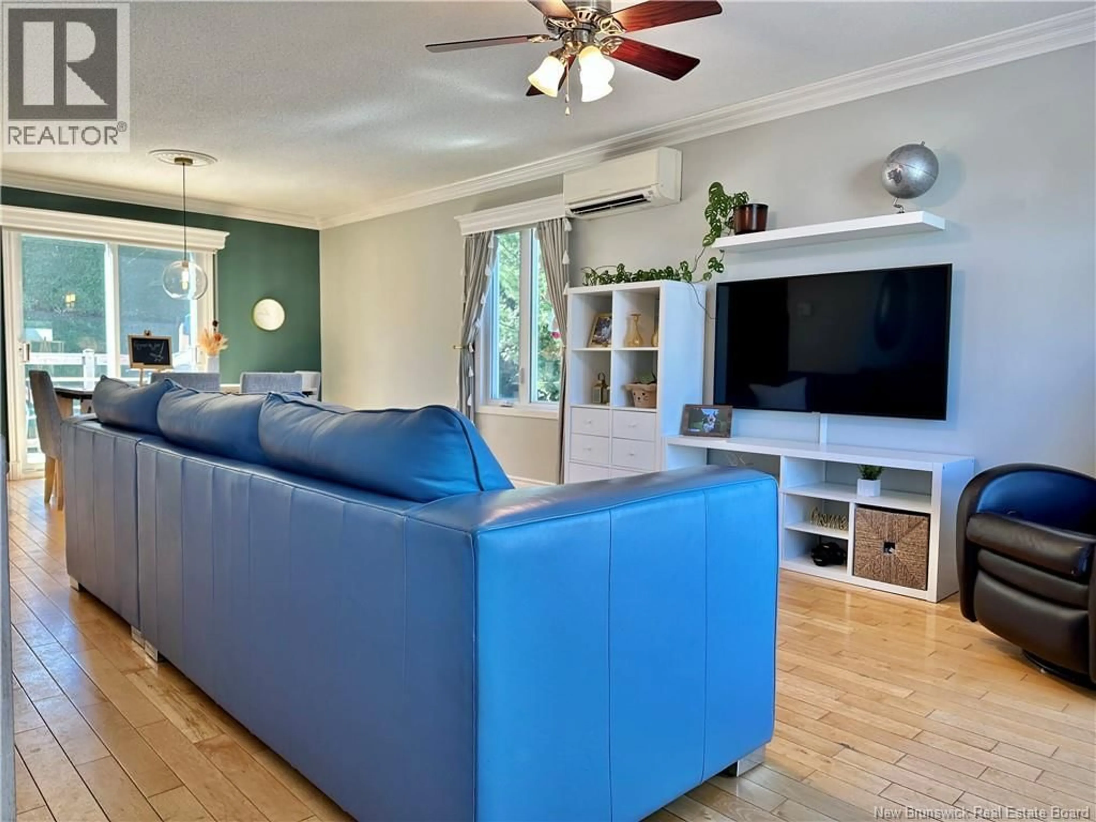 Living room with furniture, wood/laminate floor for 121 BELISLE AVENUE, Edmundston New Brunswick E3V4C7