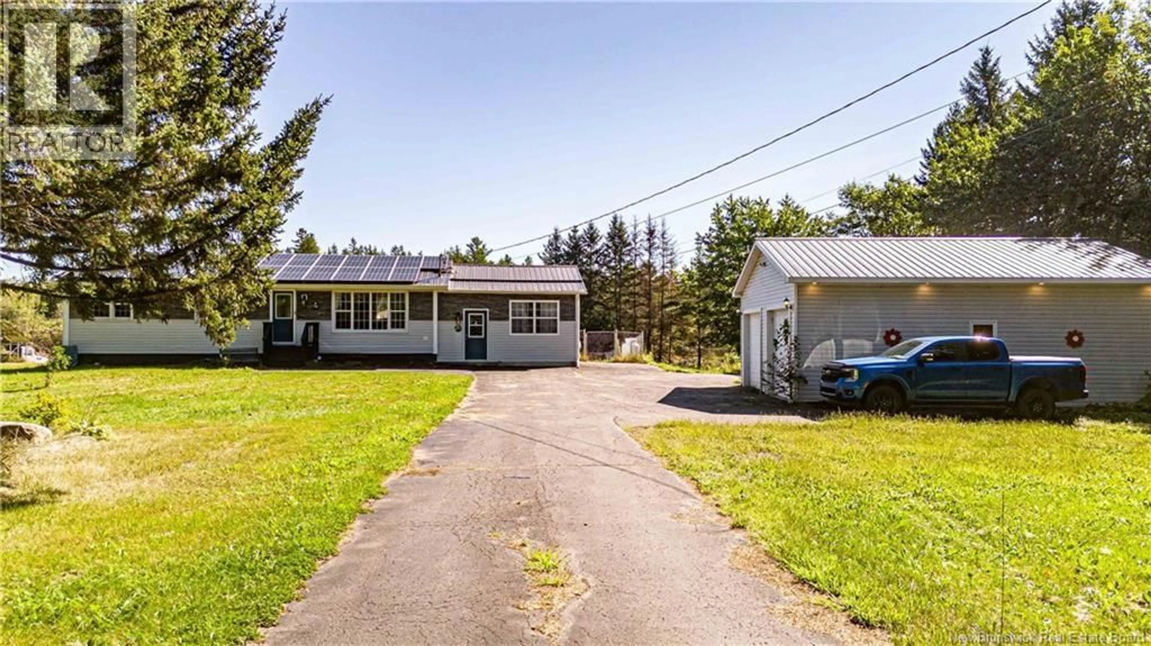 A pic from outside/outdoor area/front of a property/back of a property/a pic from drone, street for 711 MAIN STREET, Chipman New Brunswick E4A2R6