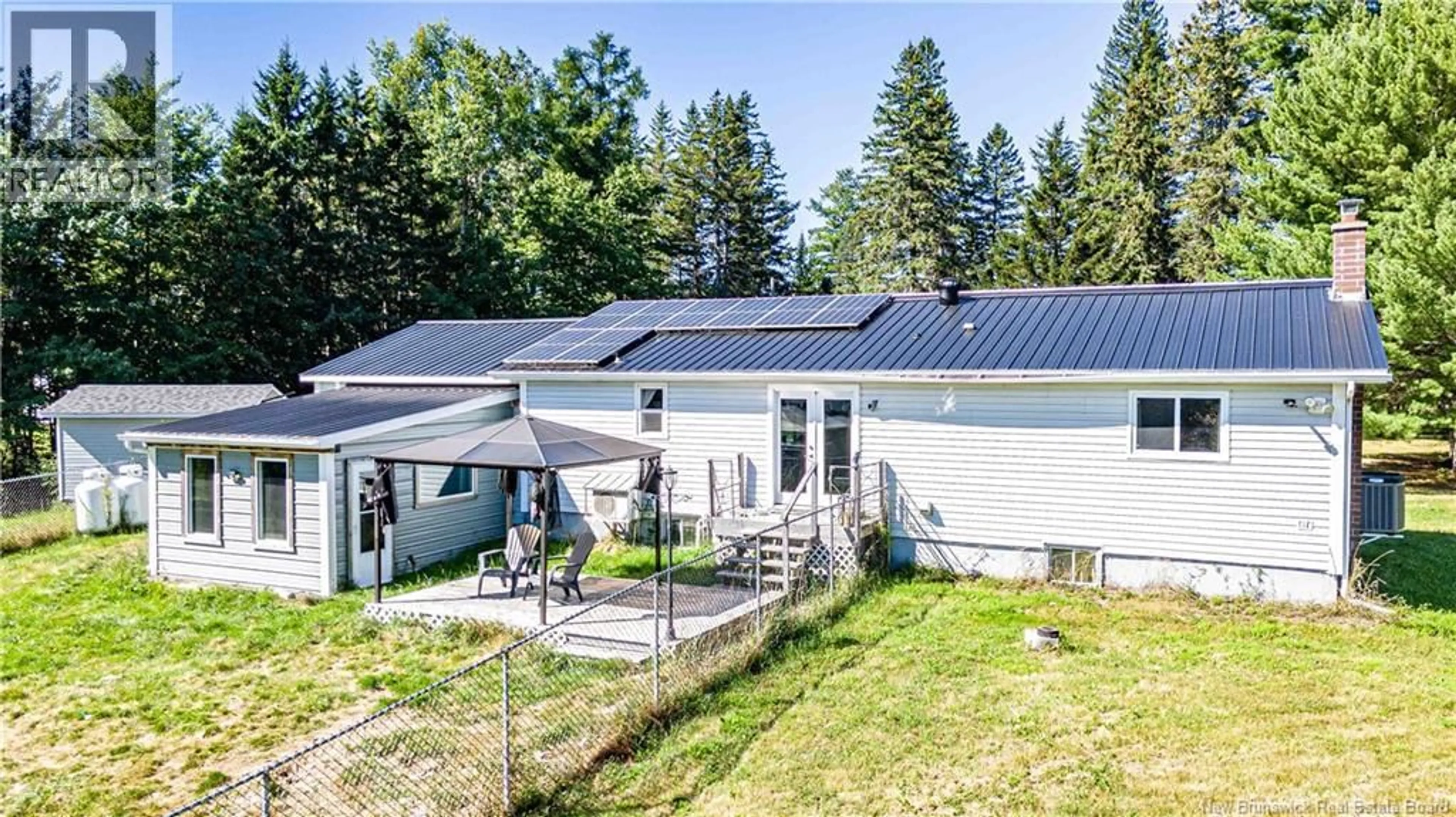 A pic from outside/outdoor area/front of a property/back of a property/a pic from drone, unknown for 711 MAIN STREET, Chipman New Brunswick E4A2R6