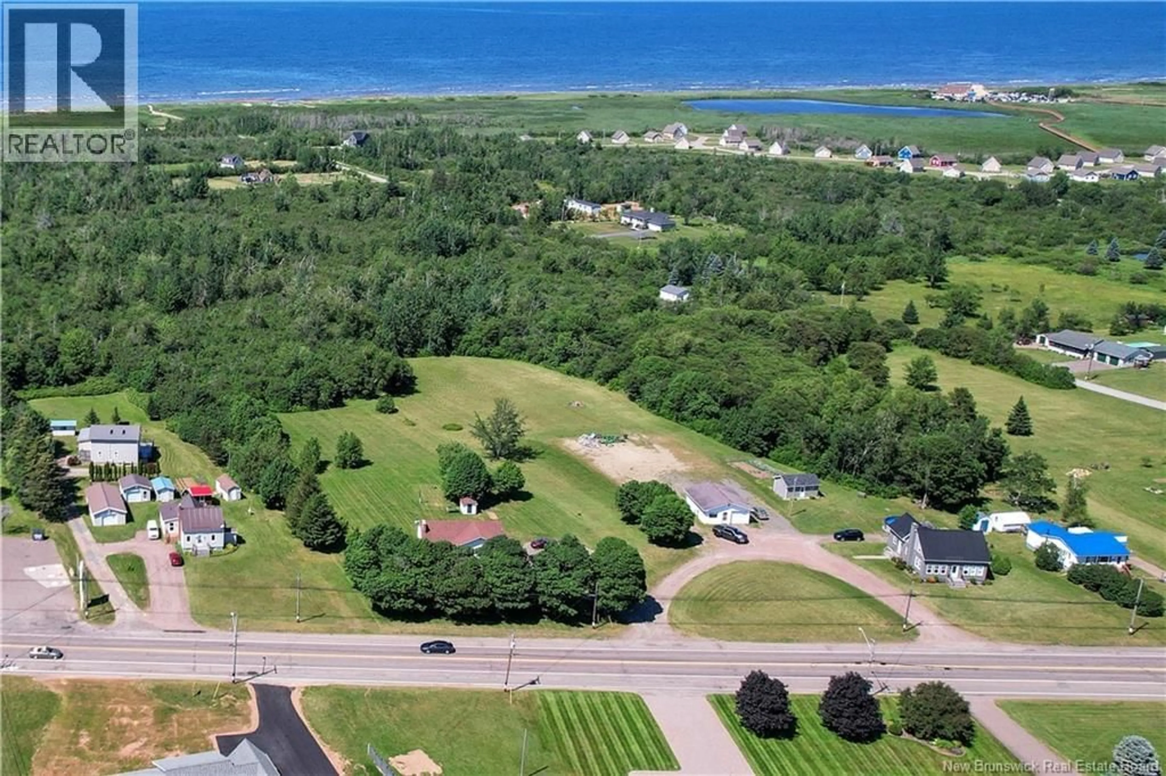 A pic from outside/outdoor area/front of a property/back of a property/a pic from drone, water/lake/river/ocean view for 2260 ACADIE ROAD, Cap-Pelé New Brunswick E4N1C2