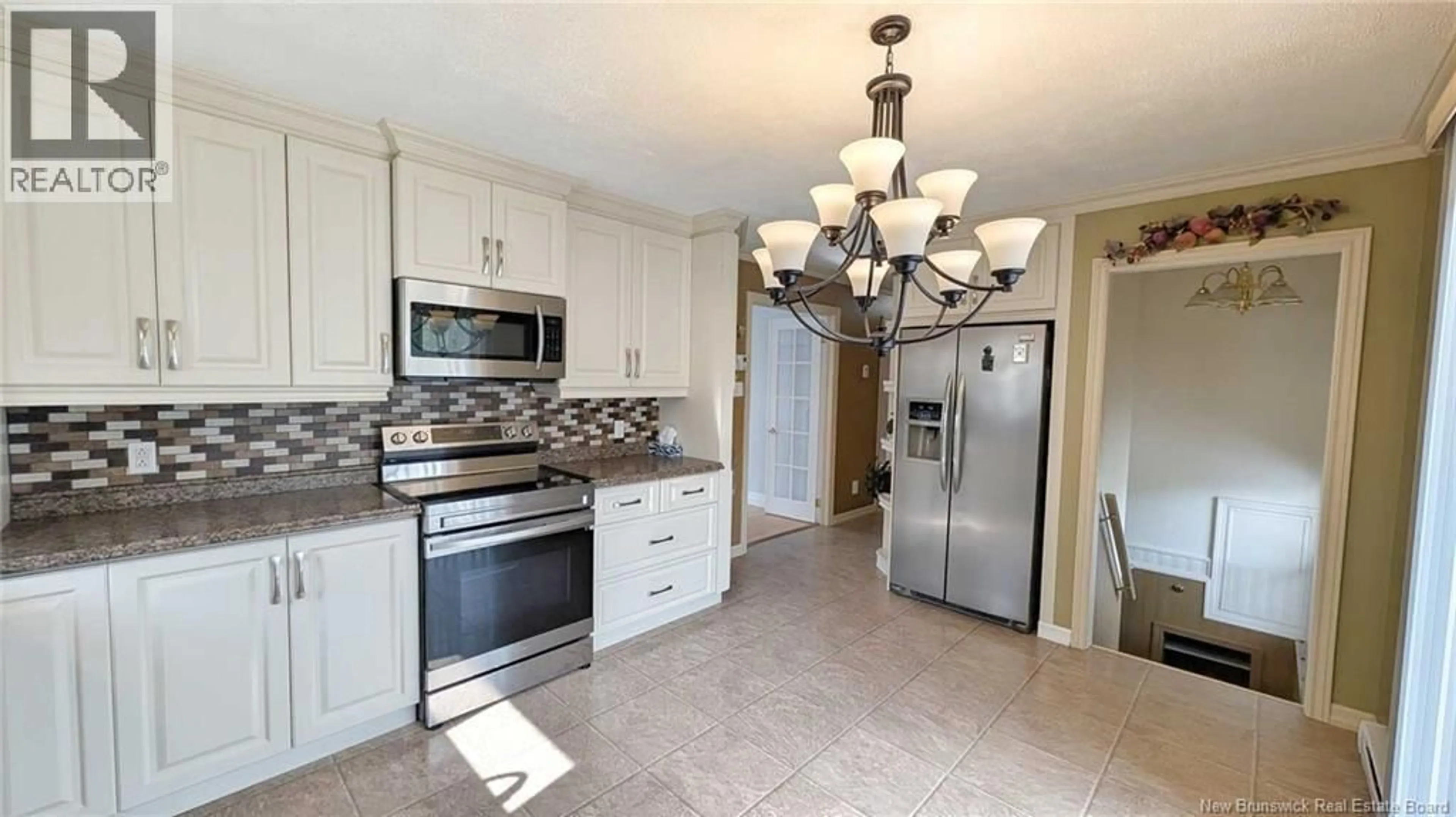 Open concept kitchen, ceramic/tile floor for 183 LANDRY STREET, Beresford New Brunswick E8K1G9