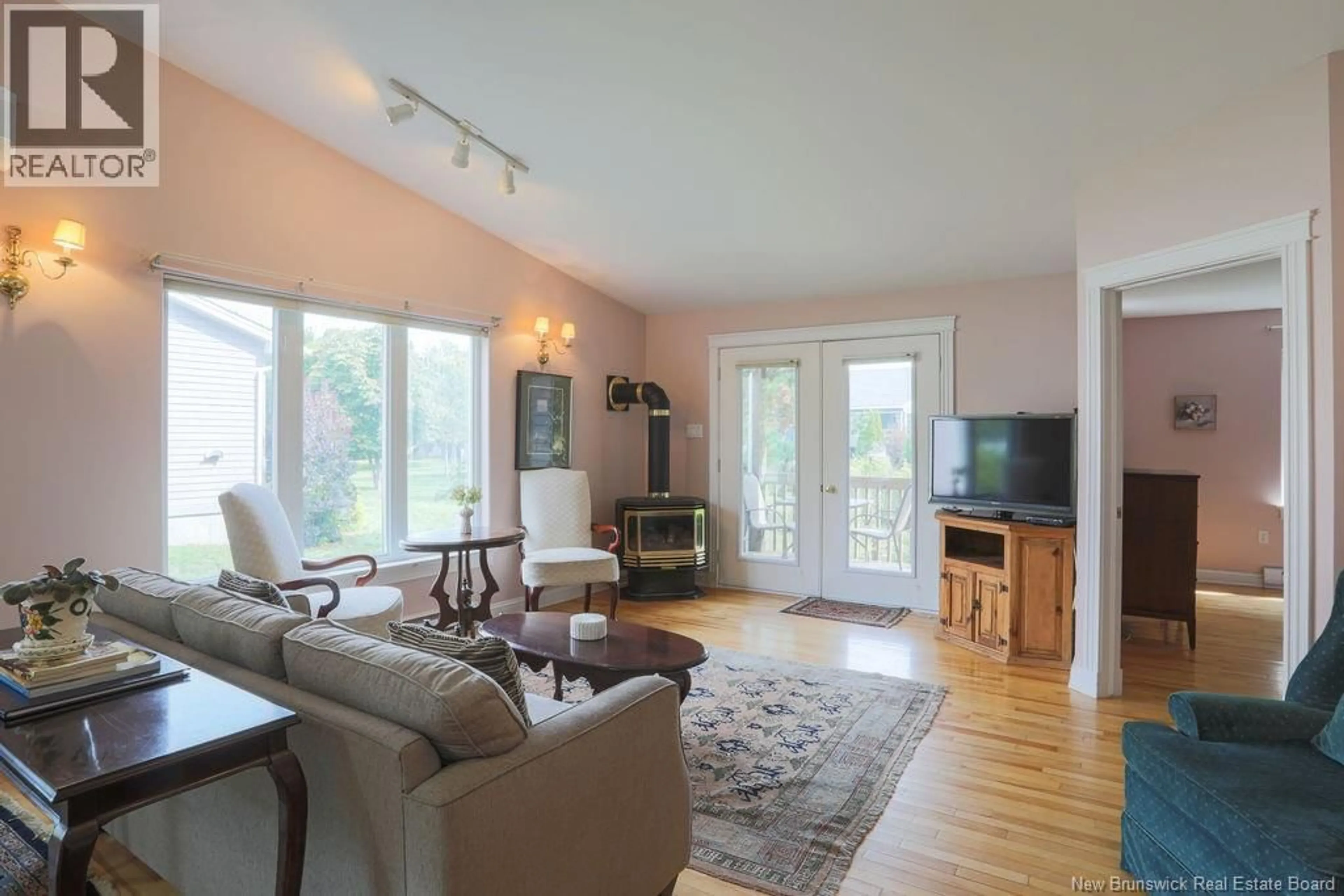 Living room with furniture, wood/laminate floor for 12 WINDERMERE COURT, Rothesay New Brunswick E2E5Y4