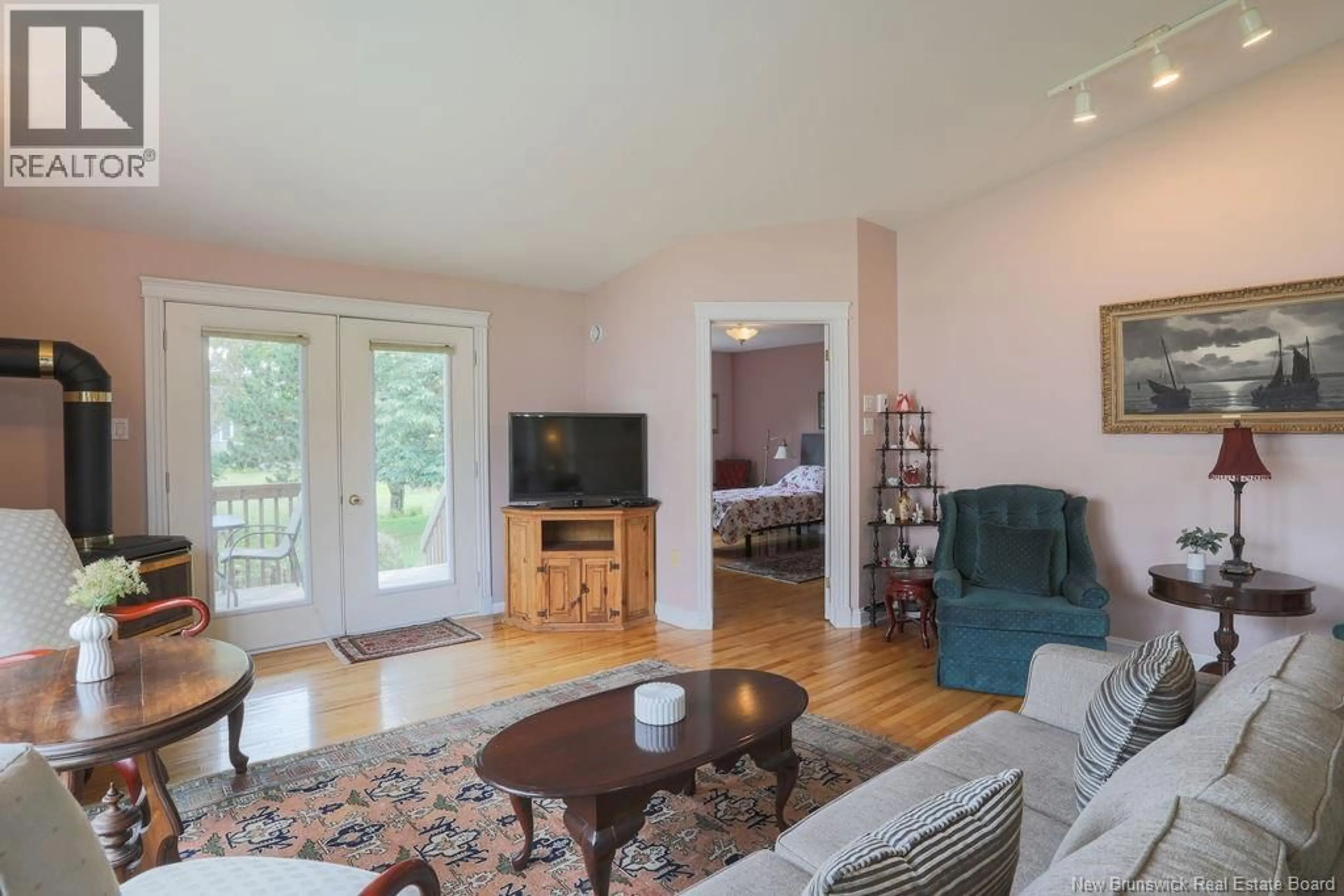Living room with furniture, wood/laminate floor for 12 WINDERMERE COURT, Rothesay New Brunswick E2E5Y4