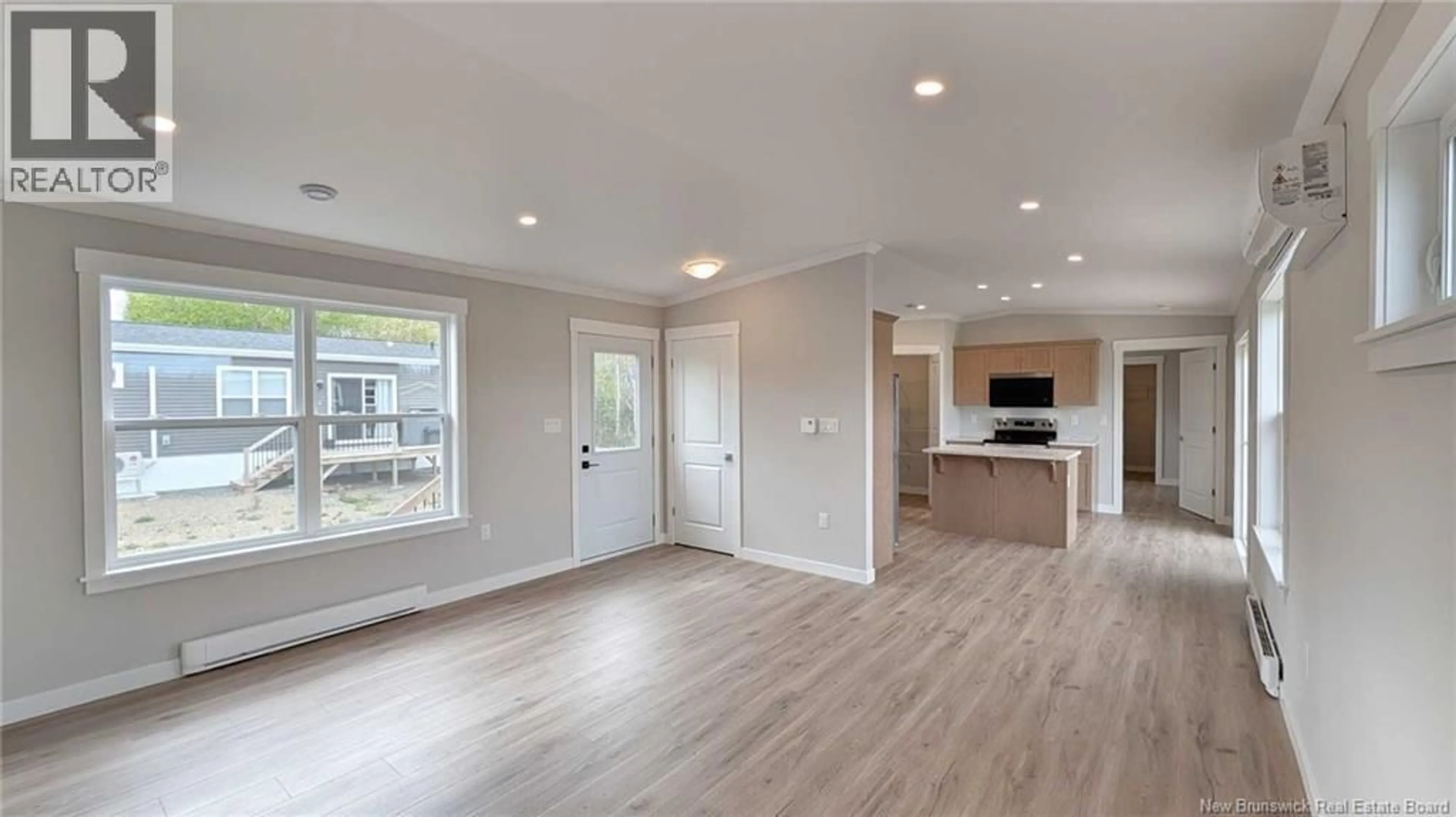 Open concept kitchen, wood/laminate floor for 223 RUE BELLA VISTA, Tracadie New Brunswick E1X4W1