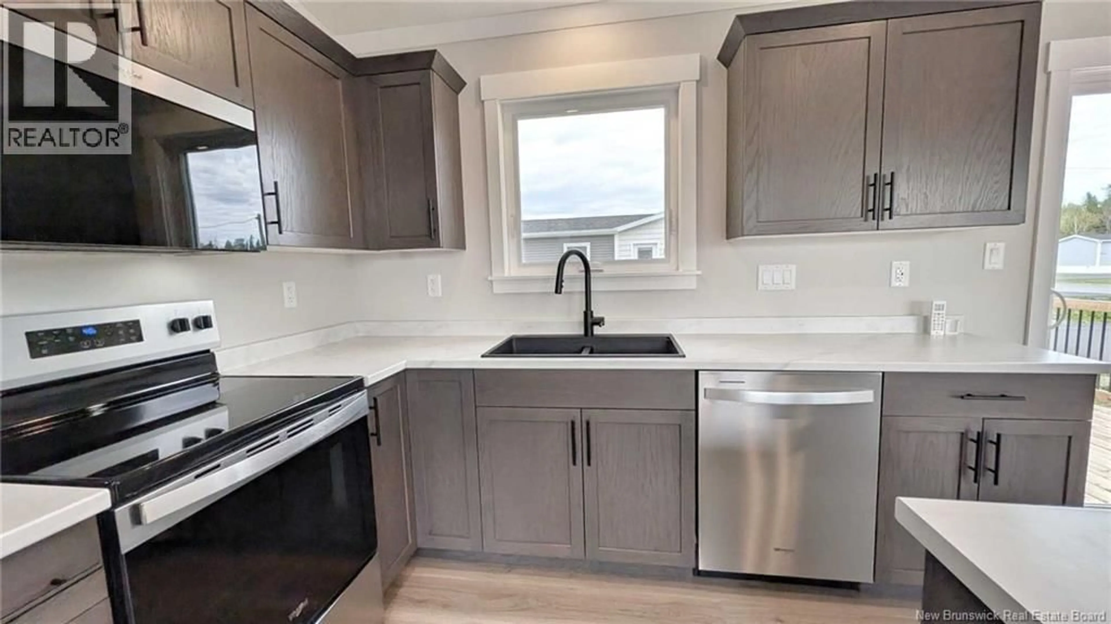 Open concept kitchen, ceramic/tile floor for 231 RUE BELLA VISTA, Tracadie New Brunswick E1X4W1