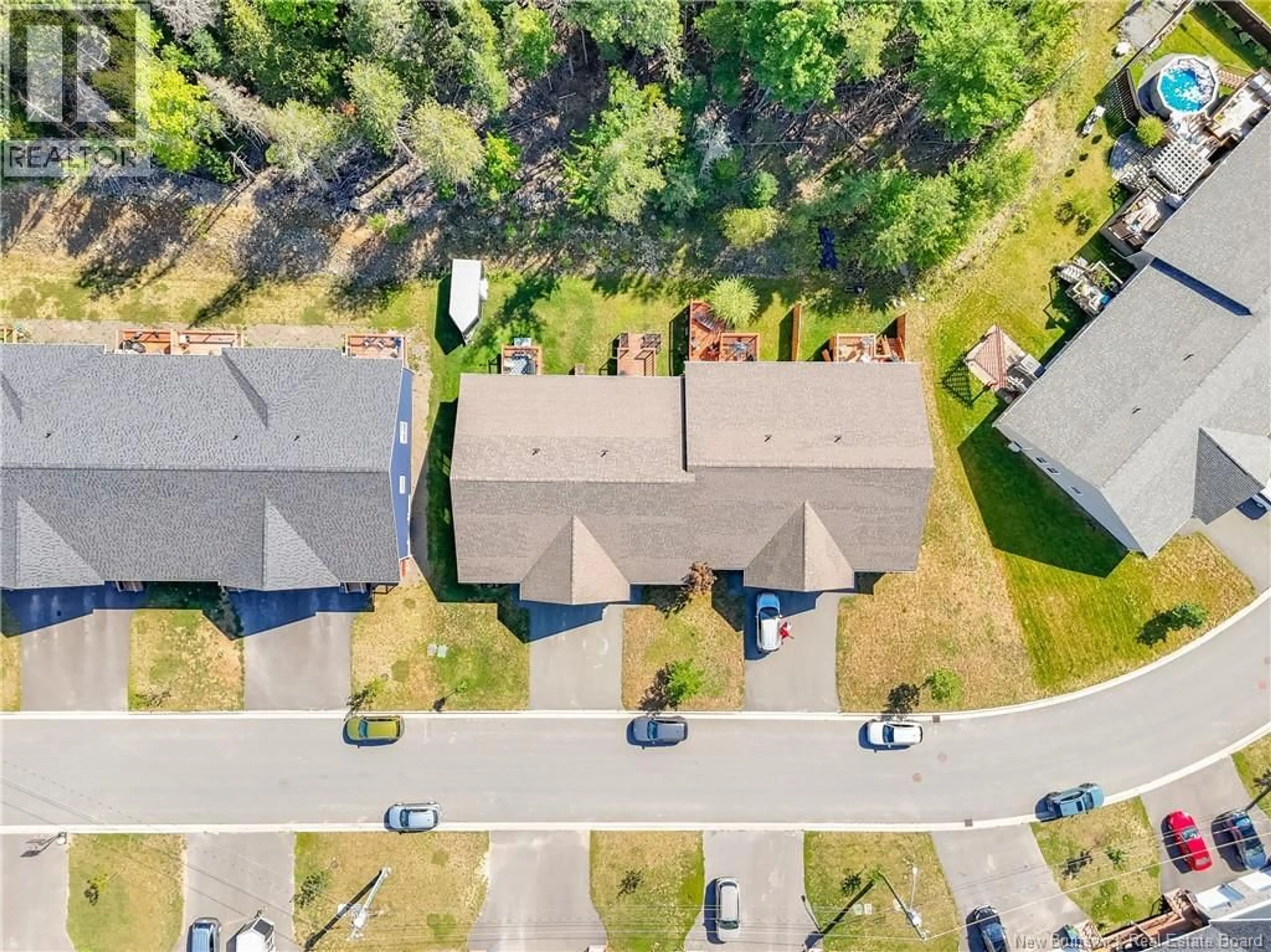 A pic from outside/outdoor area/front of a property/back of a property/a pic from drone, street for 34 CARDING WAY, Fredericton New Brunswick E3A5X5