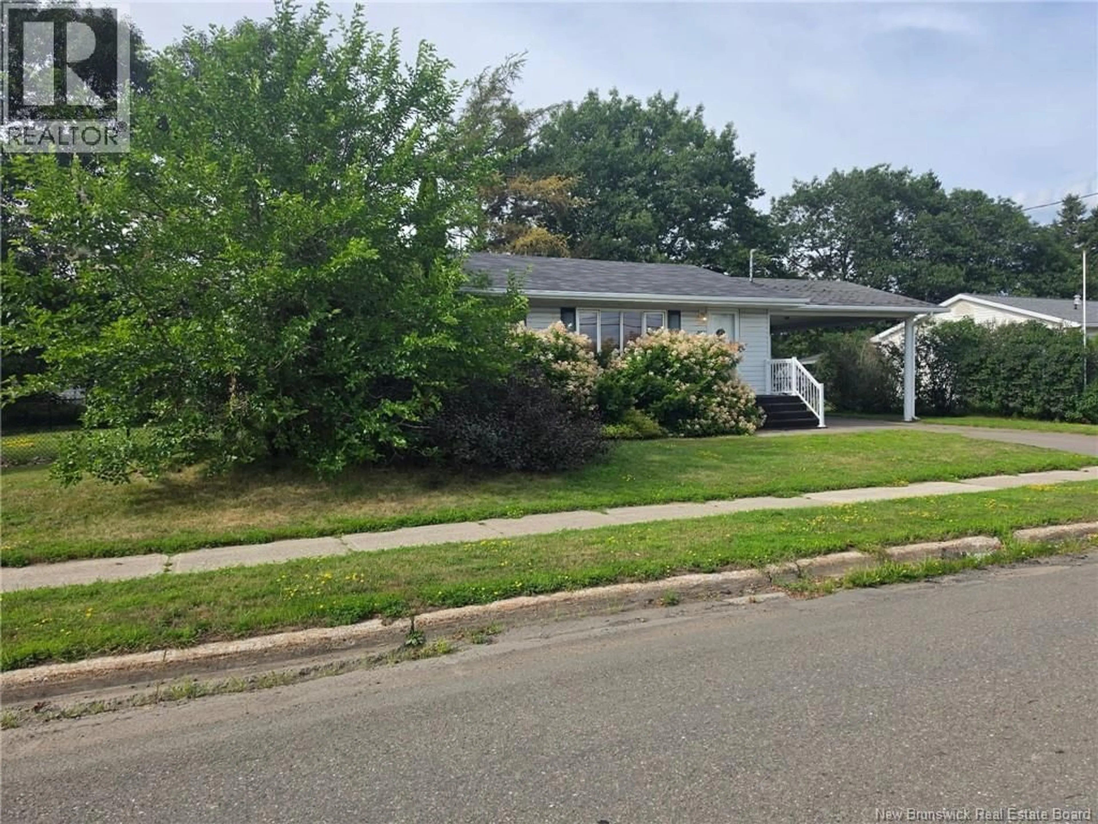 Home with vinyl exterior material, street for 22 RANKINE, Richibucto New Brunswick E4W4G7