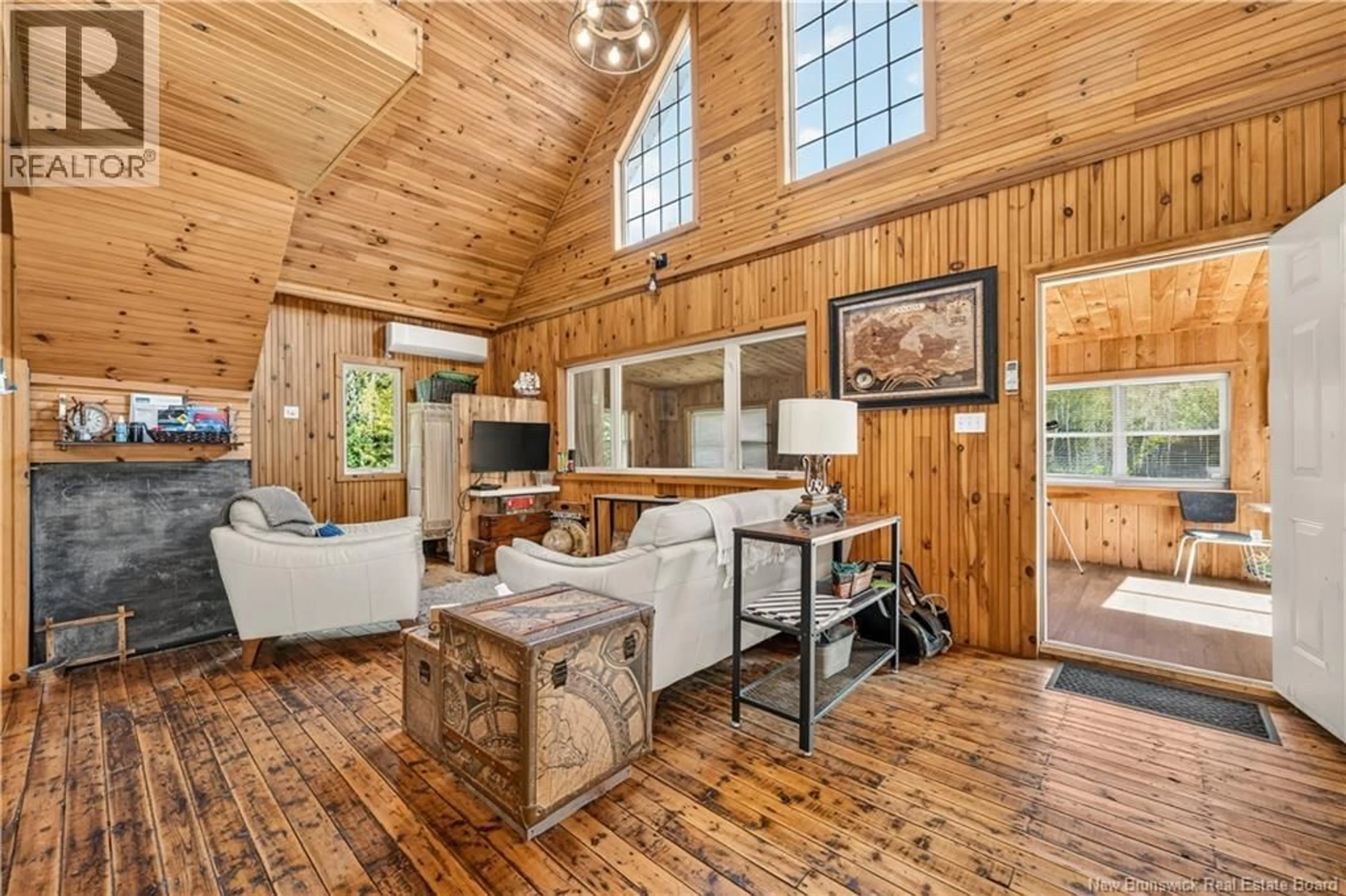 Living room with furniture, wood/laminate floor for 175 DAIGLE ROAD, Pointe-Sapin New Brunswick E1G2H4