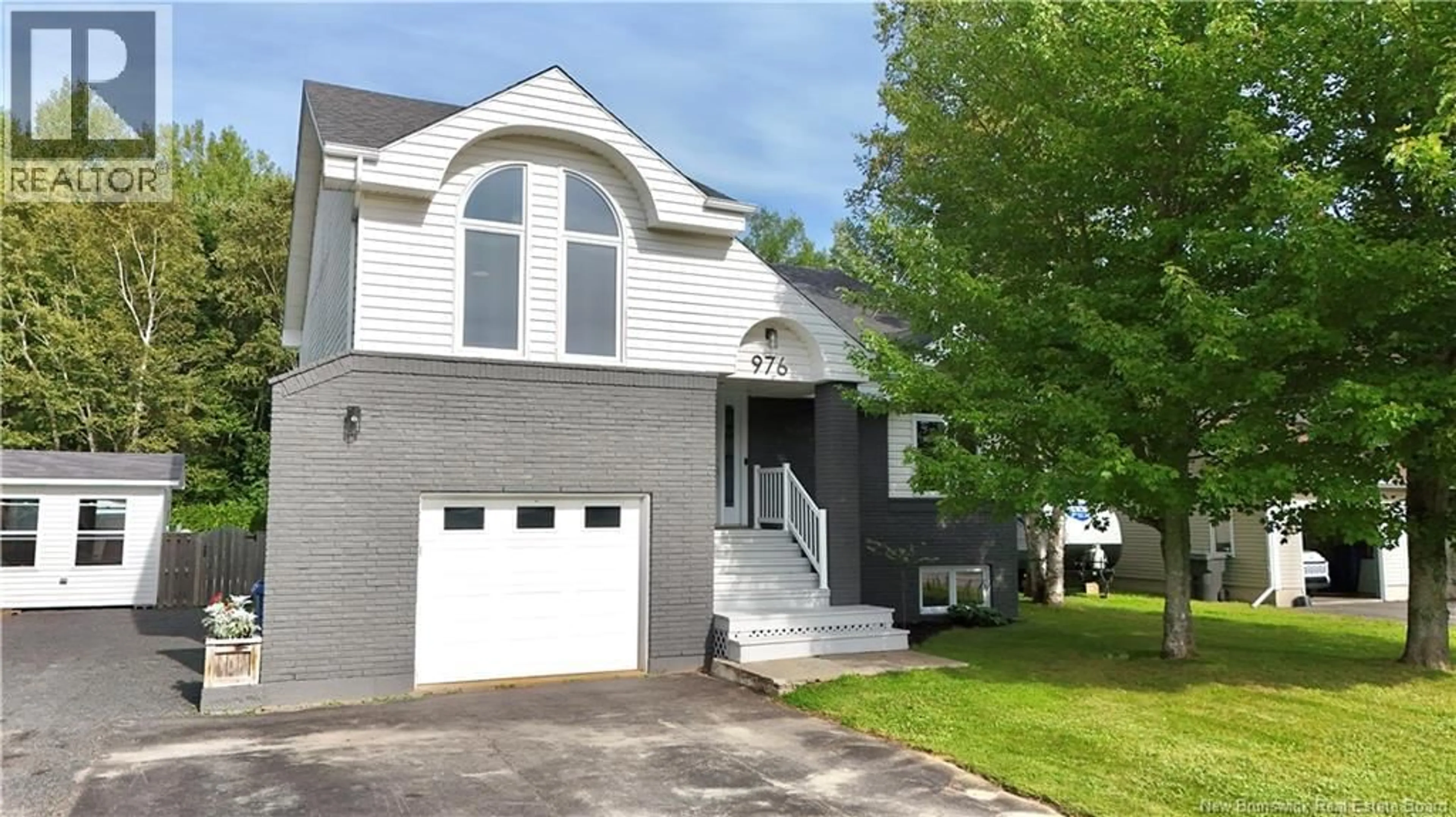 Home with vinyl exterior material, street for 976 HUARDS, Beresford New Brunswick E8K1K4