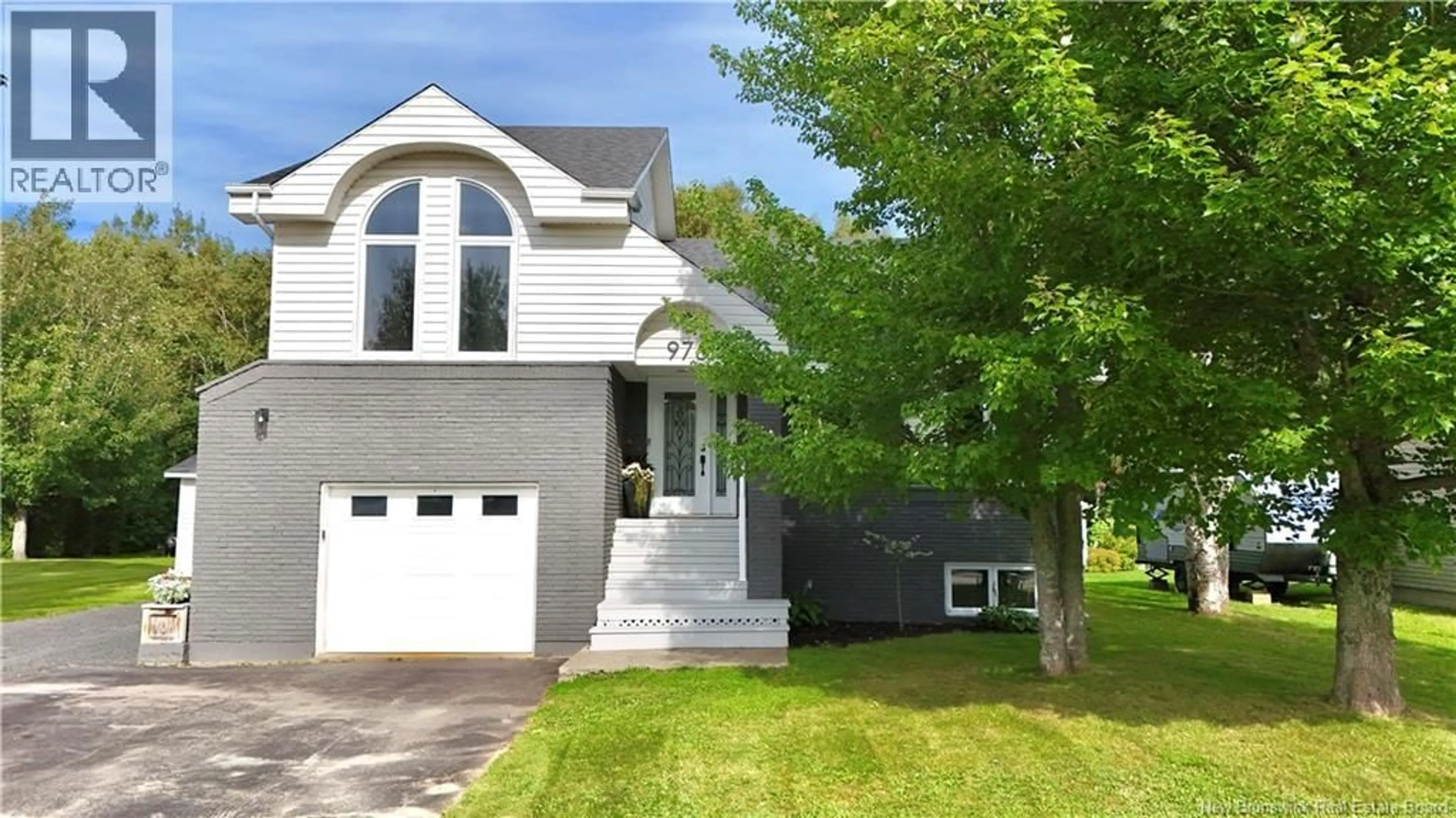 Home with vinyl exterior material, street for 976 HUARDS, Beresford New Brunswick E8K1K4