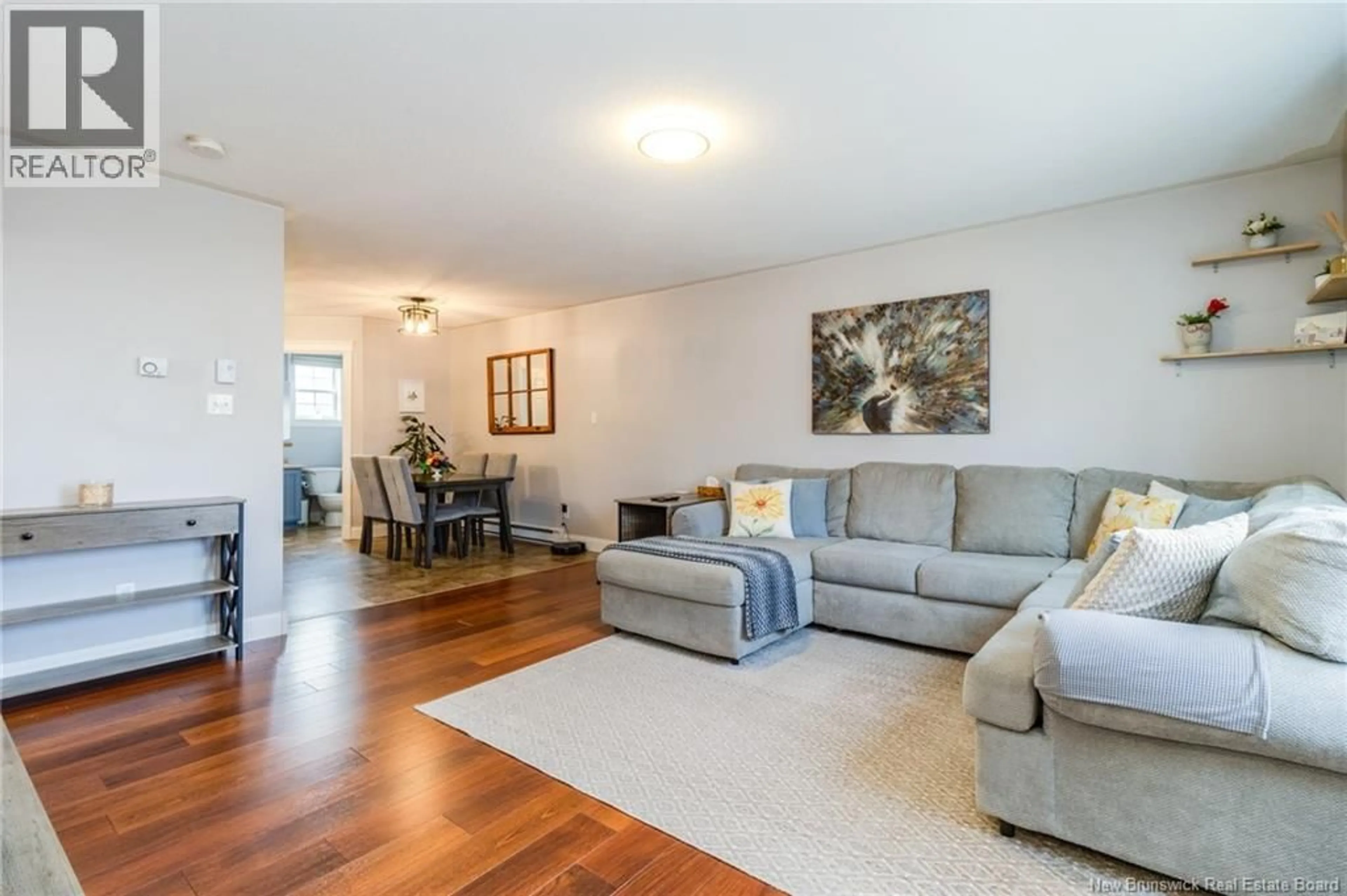 Living room with furniture, wood/laminate floor for 178 JAMES STREET, Fredericton New Brunswick E3G0N8