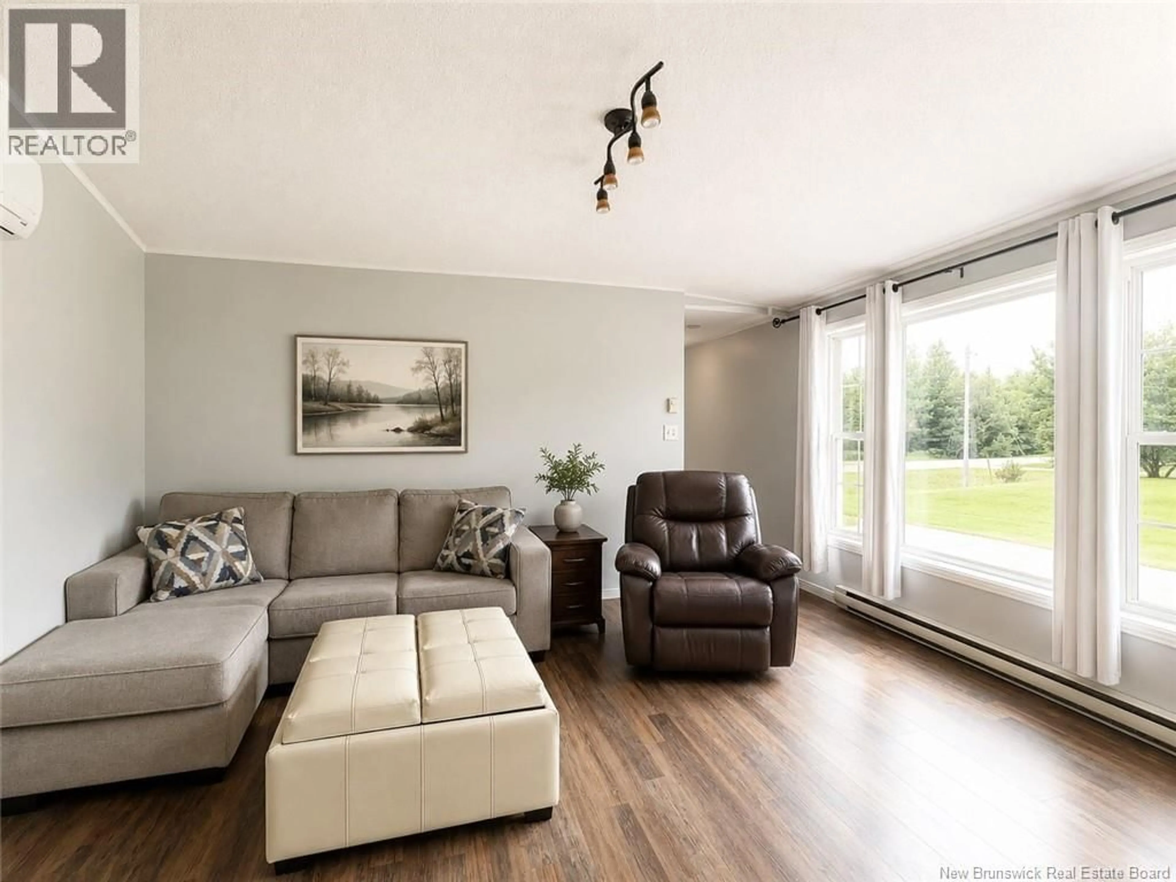 Living room with furniture, wood/laminate floor for 15 SILVERWOOD, Miramichi New Brunswick E1V5Z1
