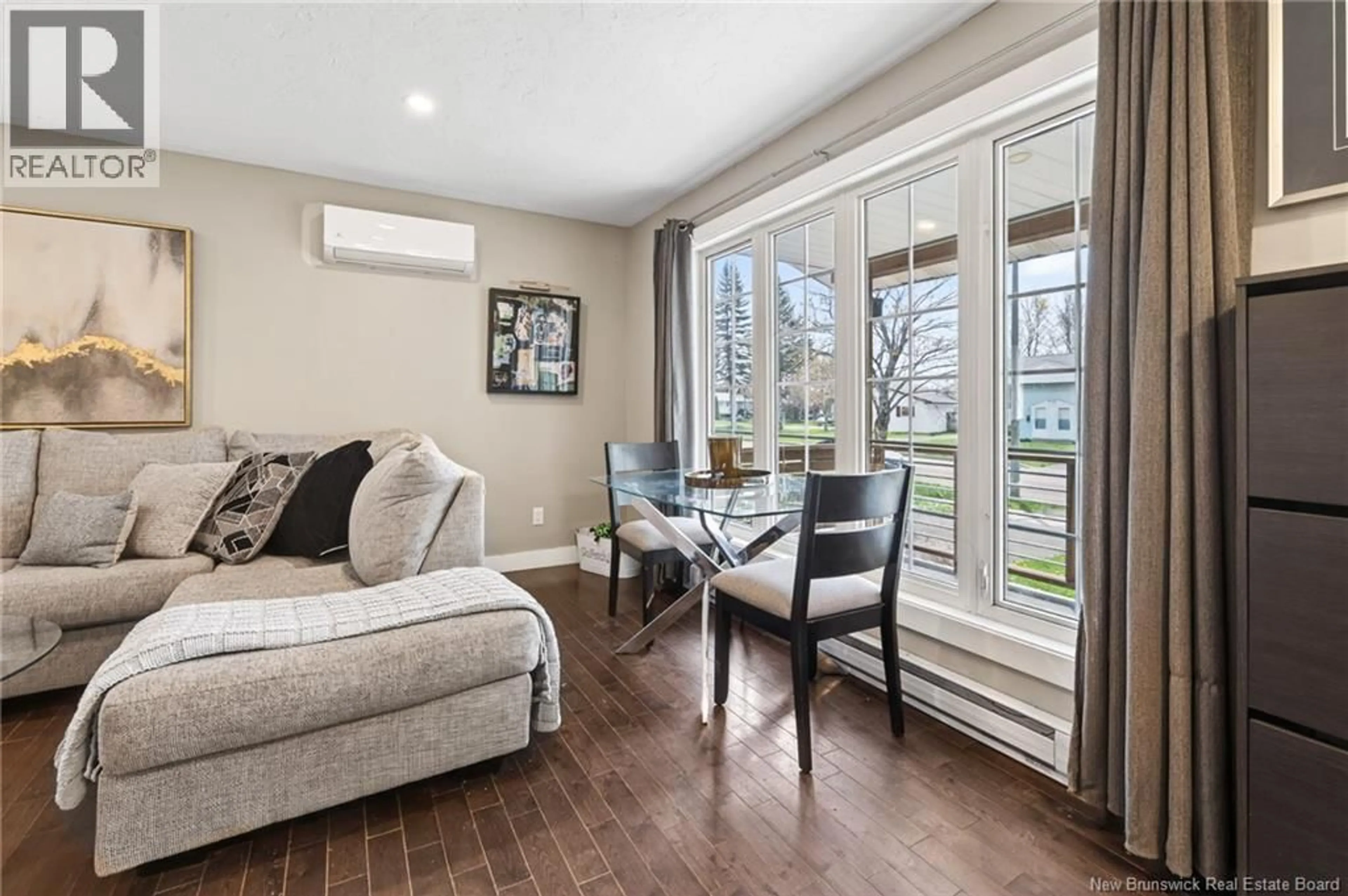 Living room with furniture, wood/laminate floor for 139 MAGELLAN, Moncton New Brunswick E1A5P3