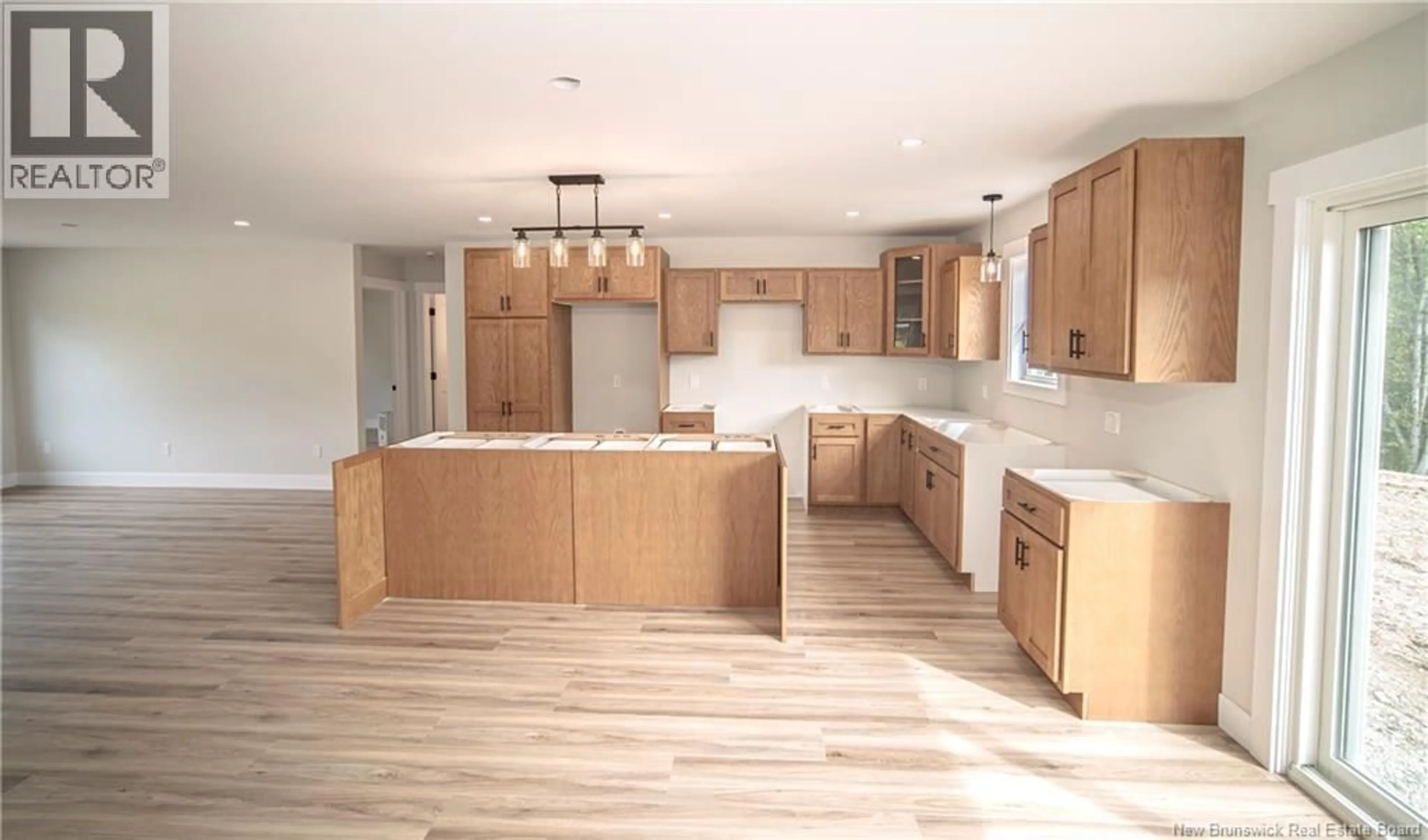 Open concept kitchen, wood/laminate floor for 23 DEWITT ROAD, Rusagonis New Brunswick E3B8X5