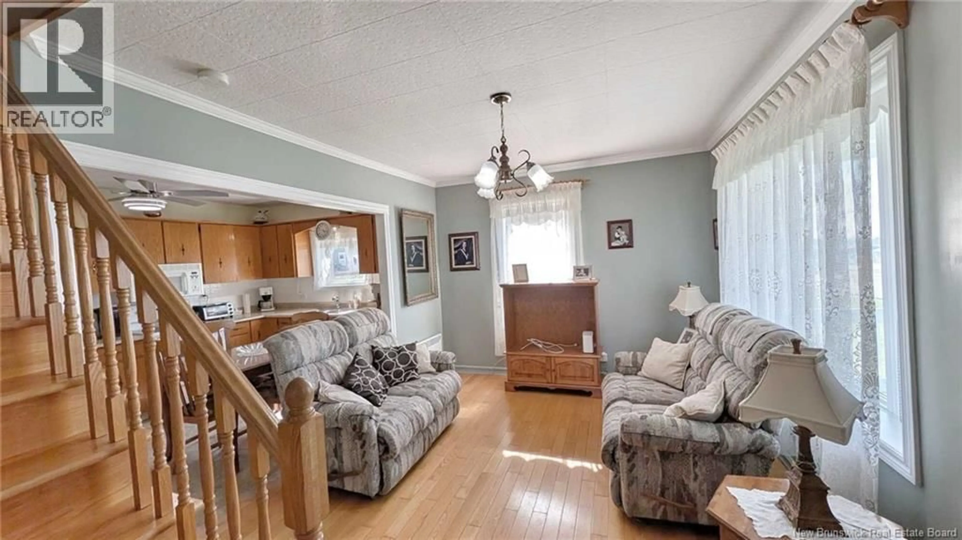 Living room with furniture, wood/laminate floor for 98 SAINT-PIERRE E BOULEVARD, Caraquet New Brunswick E1W1A9