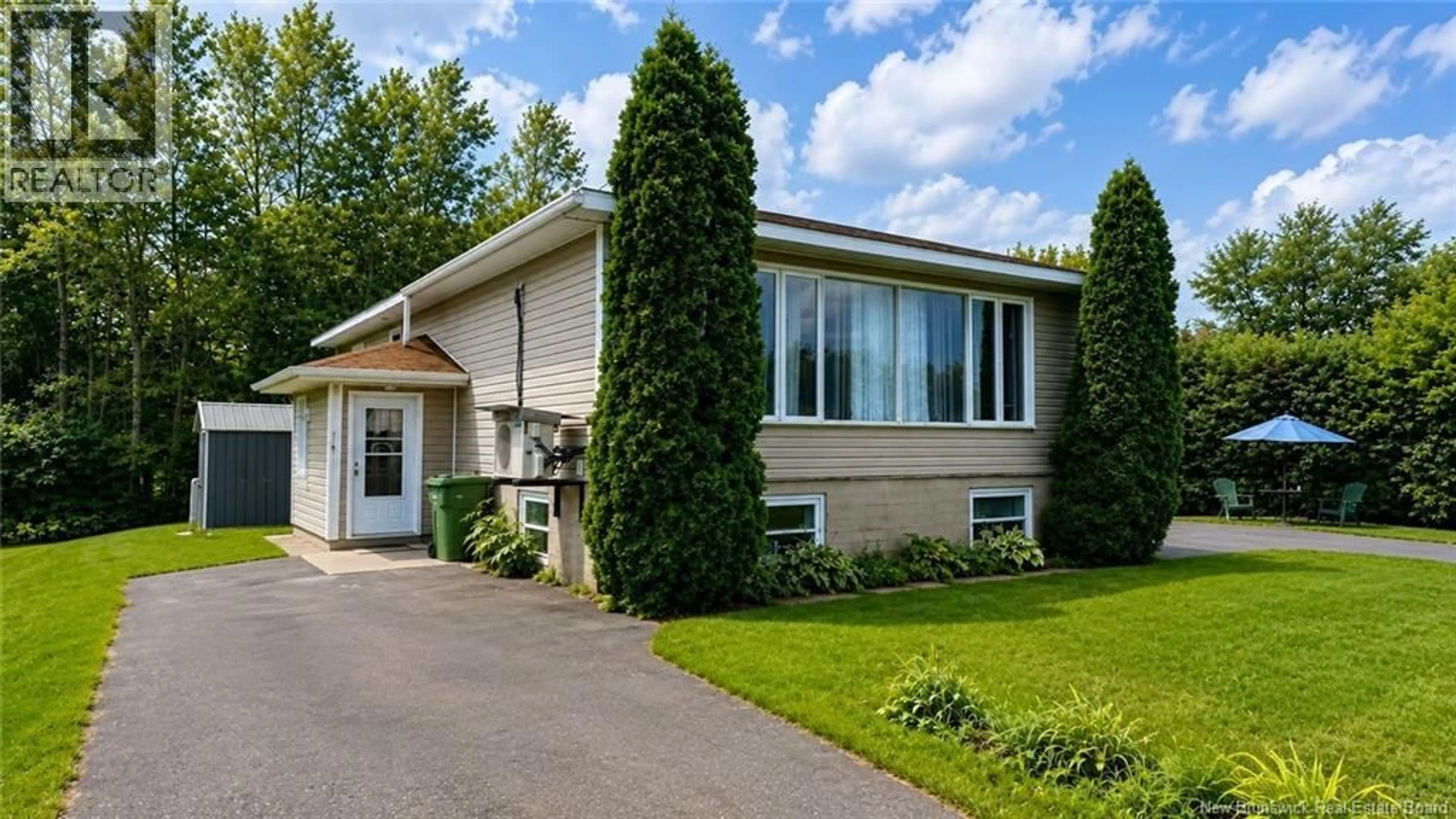 Home with vinyl exterior material, street for 1075 DANIEL DRIVE, Bathurst New Brunswick E2A3X6