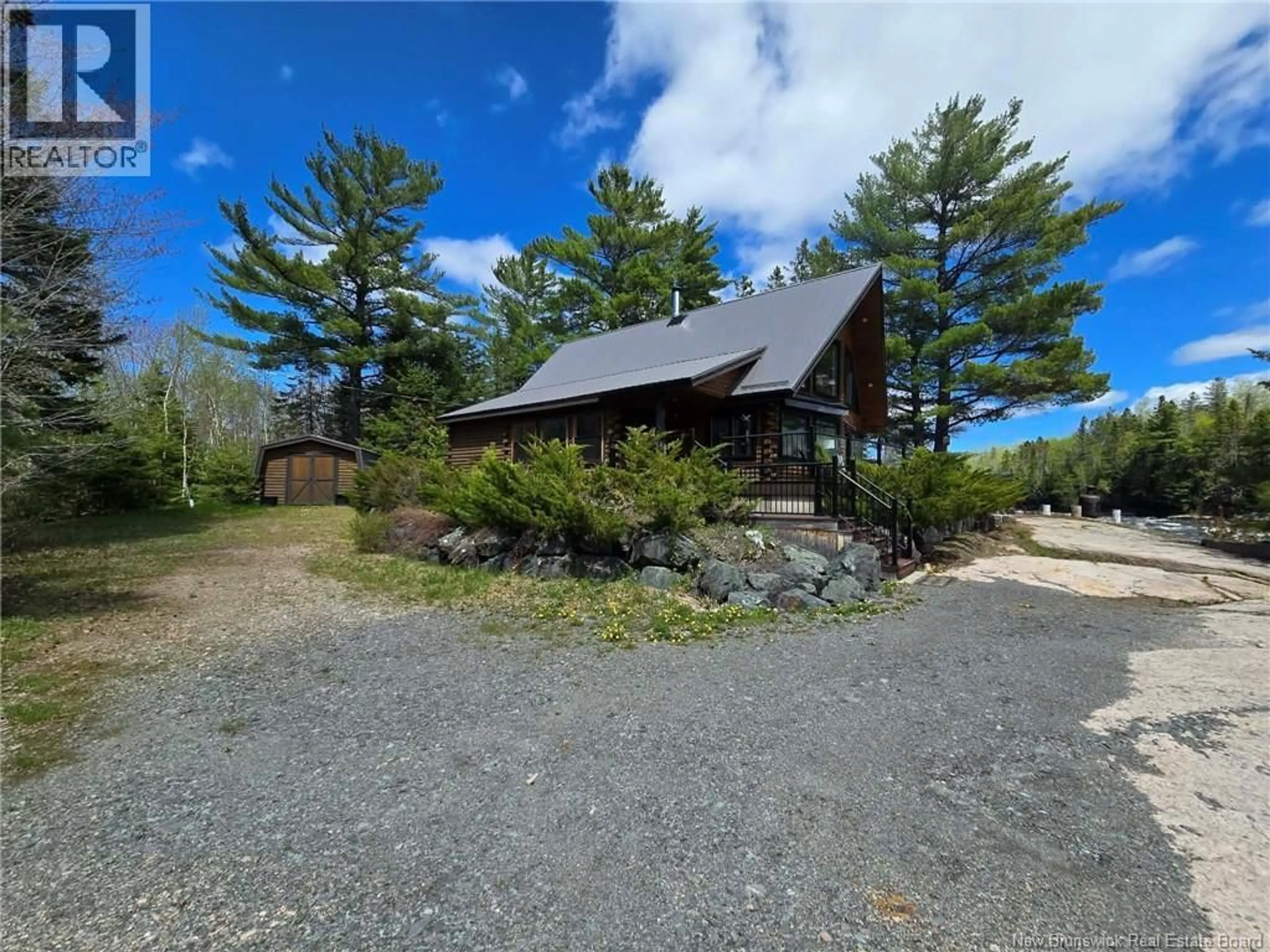 A pic from outside/outdoor area/front of a property/back of a property/a pic from drone, unknown for 52 SHAMROCK VALLEY, Big River New Brunswick E2A7M1