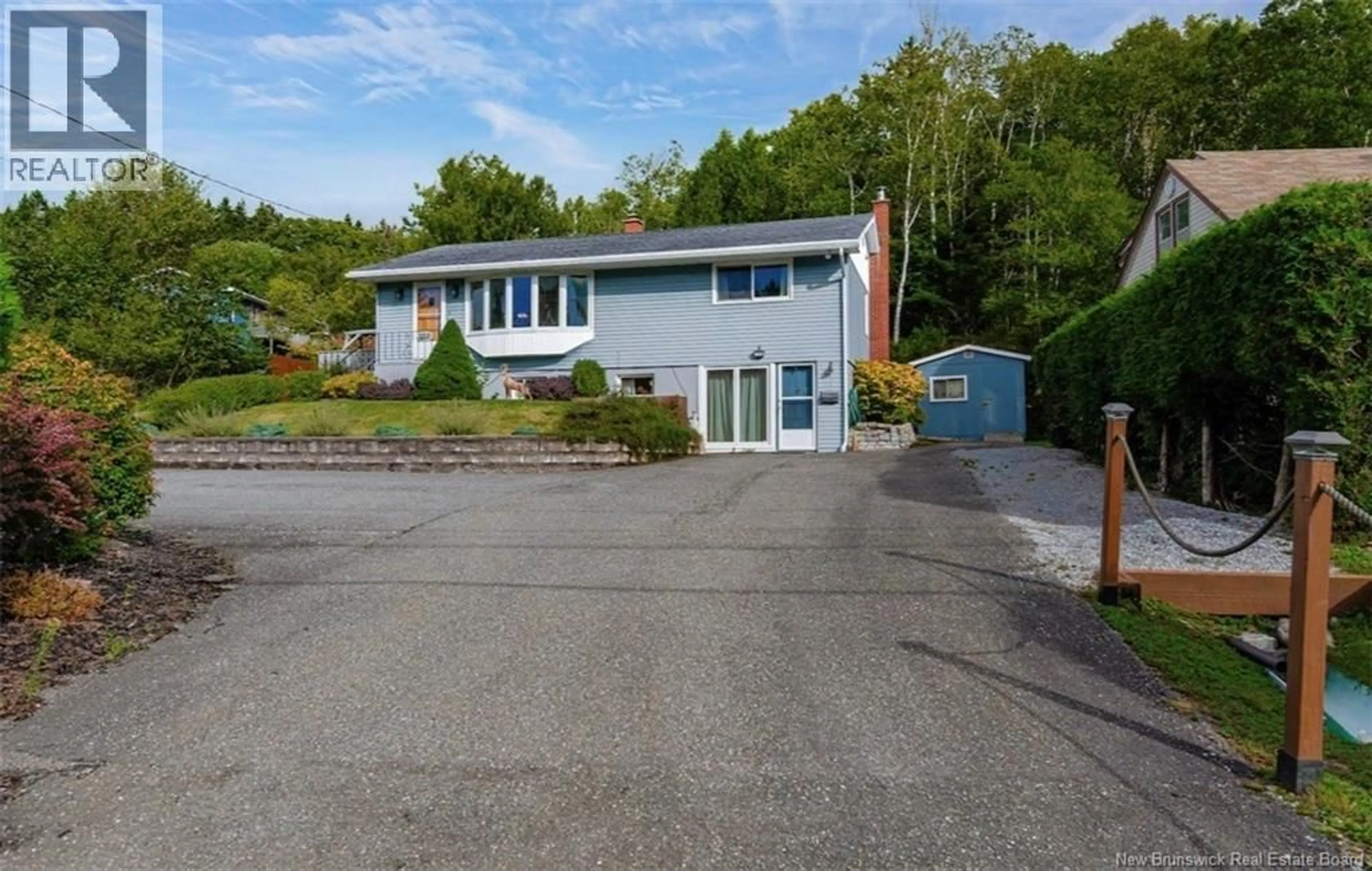 A pic from outside/outdoor area/front of a property/back of a property/a pic from drone, street for 559 SANDY POINT ROAD, Saint John New Brunswick E2K3S1
