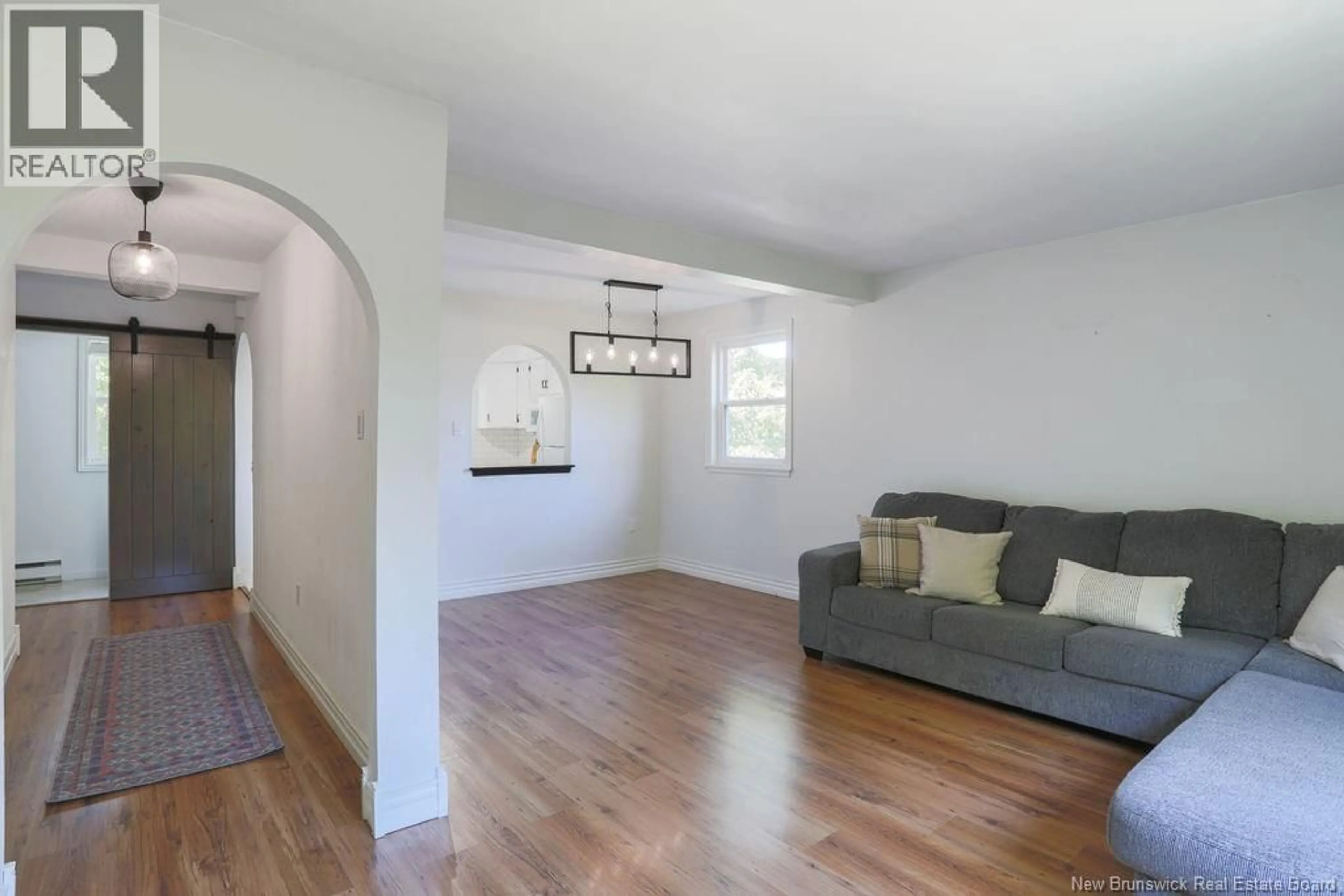 Living room with furniture, wood/laminate floor for 25 HILLSVIEW CRESCENT, Rothesay New Brunswick E2E3N5