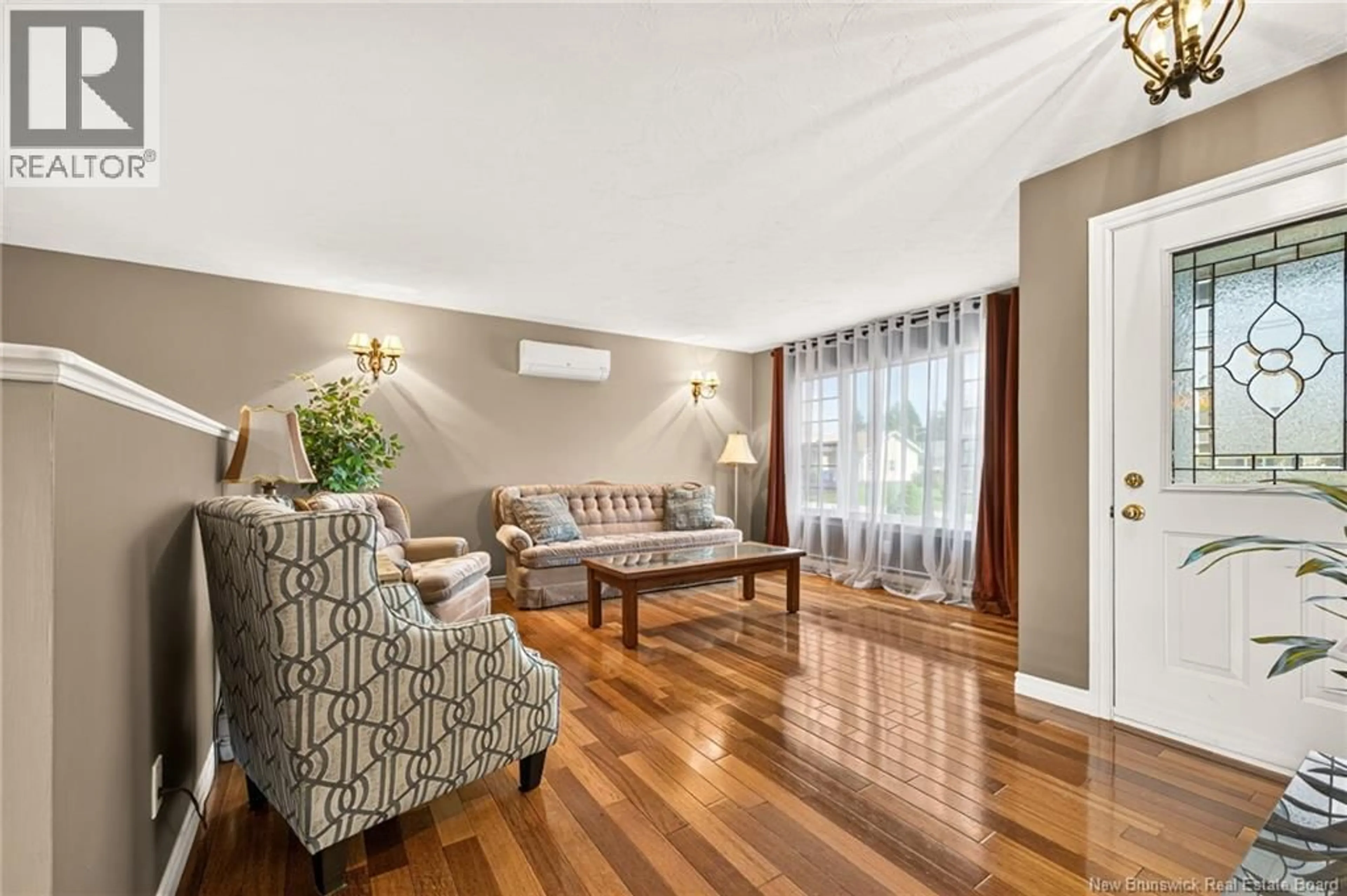 Living room with furniture, wood/laminate floor for 6 CHAD CRESCENT, Salisbury New Brunswick E4J3N3